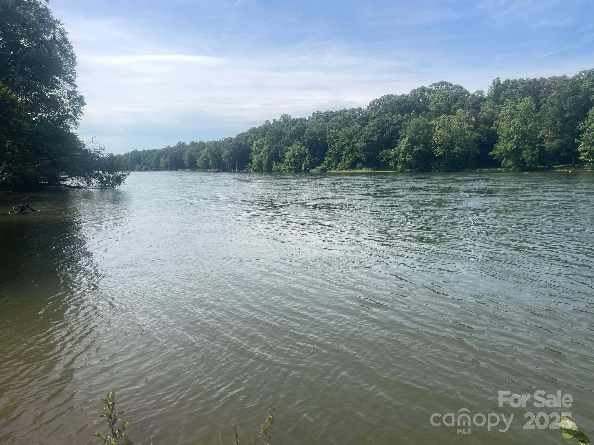 Waterfront/riverfront lot with 2.73 acres and over 400' of river frontage offers a terrific spot along the shore for waterfront enjoyment (fishing, campfires, swimming) and lots of space for privacy.  This one is worth taking a look at and is priced to sell.  Nice topography, mostly level at building site.  Bring your builder and build that weekend getaway or your permanent residence here!  Building site is along the street/front of the lot, as there is a conservation easement protecting the river for a distance of 100' from the river.  Property lies within floodplain zone AE -- no dock allowed here