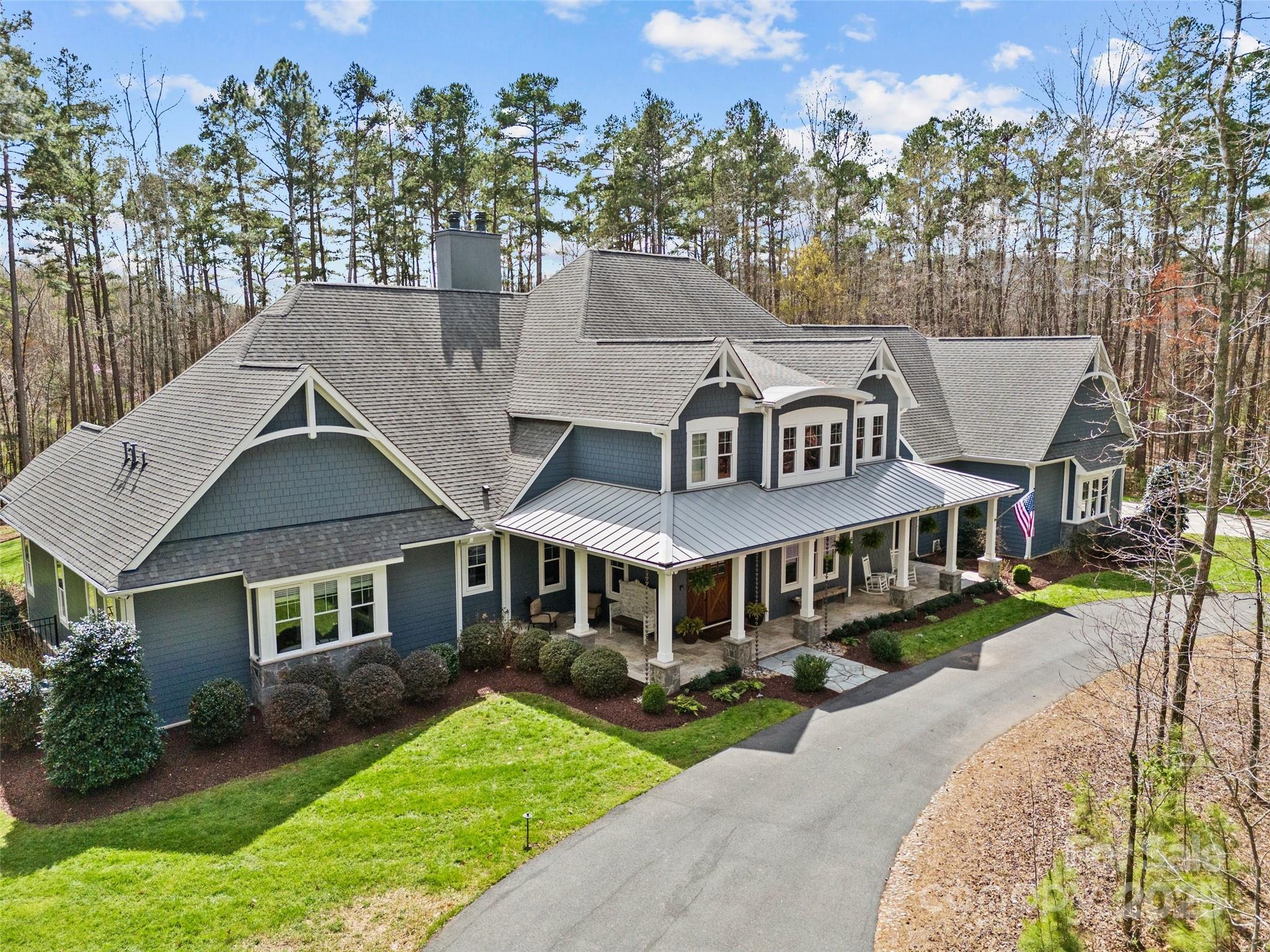 Exceptional Opportunity! Custom craftsman style home in gated equestrian community. Situated on almost 7 secluded acres, this home offers the ultimate in privacy with an adjacent ten acre preserve - truly a sanctuary. Enjoy nature in this wooded setting via the heated, saltwater pool, spa, 4-mile hiking/horse trail, garden and chicken coop. Wide plank solid oak floors, primary bedroom and guest suite on main level. Chef's kitchen includes 30" SubZero refrigerator & freezer, Wolf gas range with double ovens, expansive 9-foot island, 2 Bosch dishwashers, separate prep sink and walk-in pantry. Wet bar includes 200-bottle wine refrigerator & ice maker. Control4 Smart technology app for hvac, music, tv, exterior cameras & lights. Over 1500sf of covered outdoor living space with vaulted ceiling, wood burning fireplace, 42" Lynx built-in grill, XL PrimoOval smoker, sink, audio and tvs. Laundry room on each floor, 3-car oversized garage, 2 tankless water heaters, generator, irrigation, alarm.