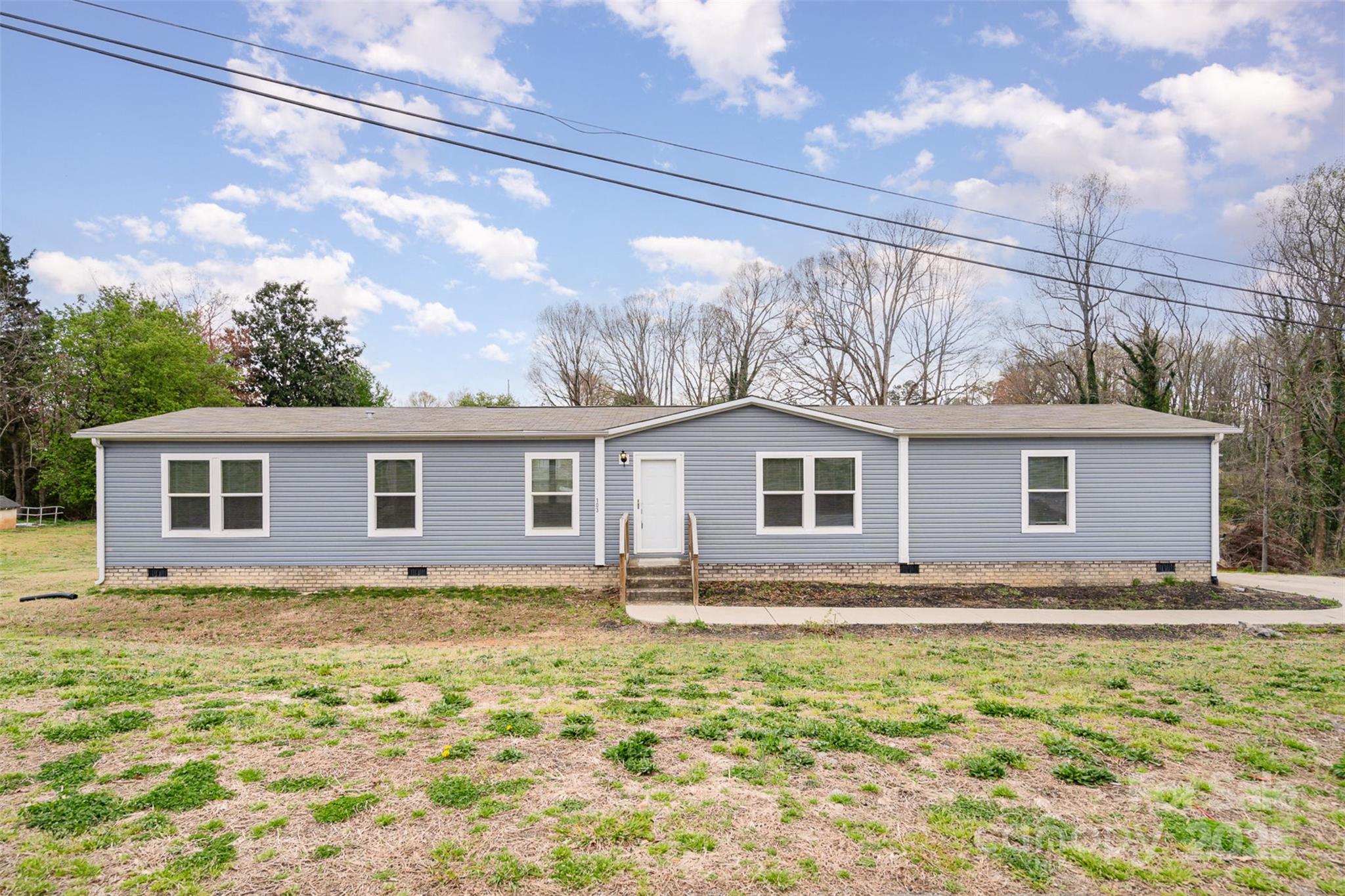 Welcome to 103 Crown Ct in Kings Mountain! This inviting manufactured home features 4 comfortable bedrooms and 2 full baths, perfect for anyone needing a bit of extra space. As a bonus, the sale includes the vacant lot next door (MLS #4238266), adding 0.4 acres for more room to spread out and enjoy some privacy. With no HOA, you have the freedom to make this property truly your own. Plus, being just a short commute from the casino means fun and entertainment are always close by. Schedule a showing today and see all that this home has to offer!