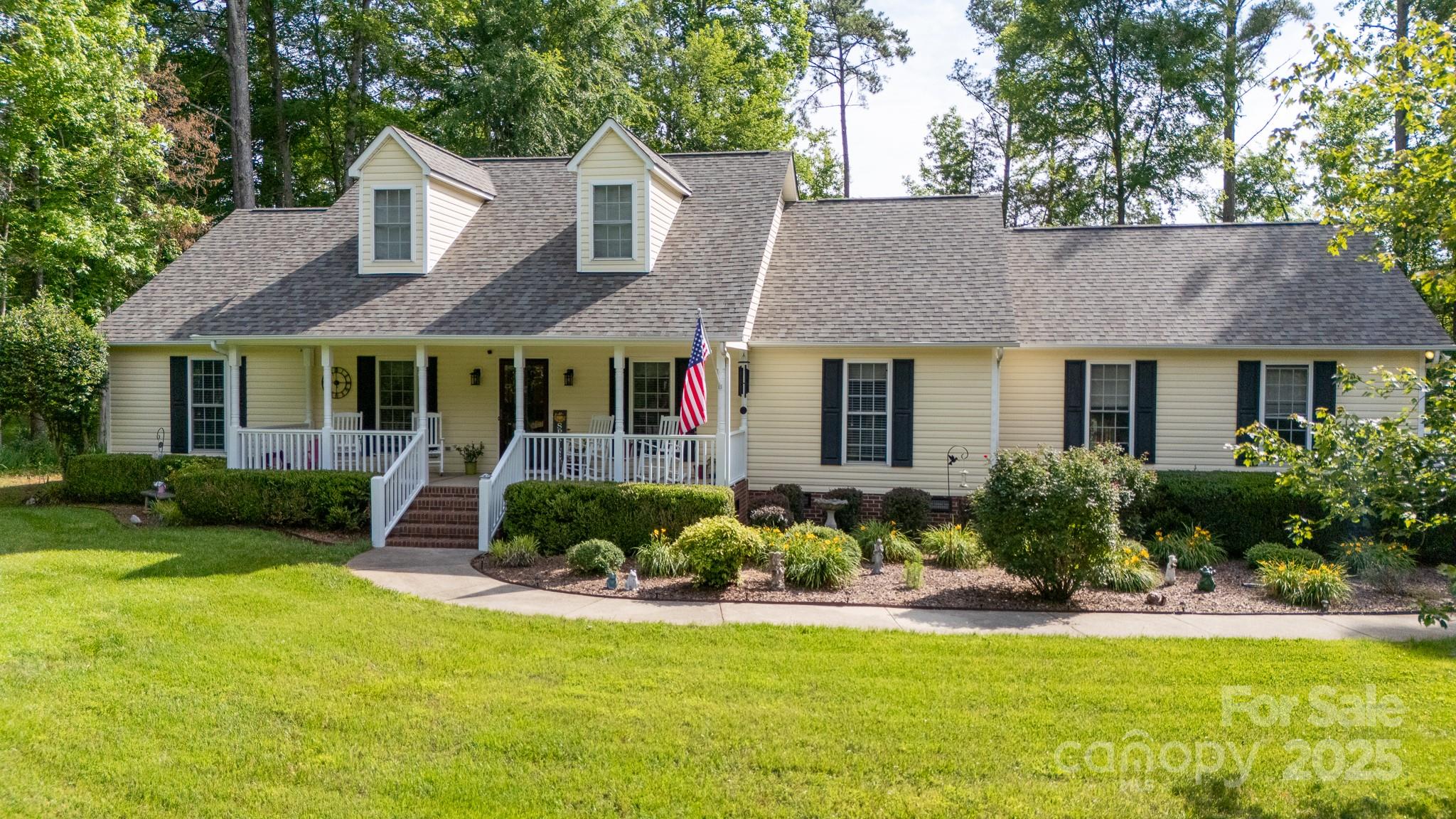 Welcome home to this beautiful ranch nestled on a level 1 ac lot on a quiet cul-de-sac street with no HOA. A classic rocking chair front porch sets the tone for a relaxed lifestyle. Inside, you'll find wood & tile floors throughout, spacious living areas & a host of recent updates—including a new roof (2025). The living room features an elegant double tray ceiling & the kitchen is well-appointed with granite countertops, stainless steel appliances, pantry & the refrigerator will remain. The primary suite is a peaceful retreat with its own tray ceiling, walk-in closet, garden tub & separate shower. The split bedroom floor plan offers privacy, with 2 large secondary bedrooms connected by a convenient Jack & Jill bath. Enjoy outdoor living on the covered rear porch overlooking the peaceful yard. Additional highlights include an oversized 2-car attached garage & a powered shed with 220-volt service & a full house generator hookup. Serene country setting just minutes from town conveniences.