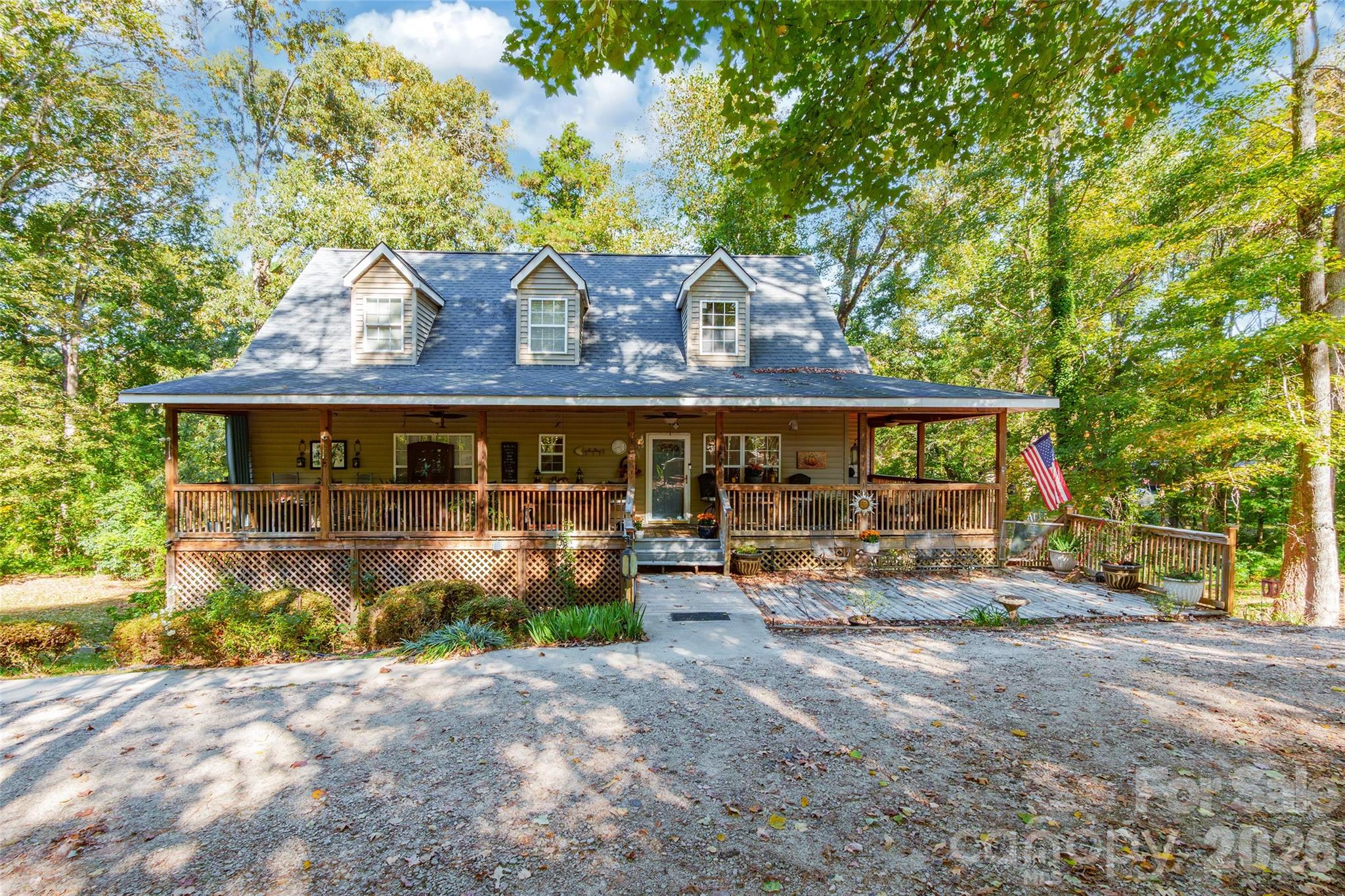 Welcome to this charming 3-bedroom, 3-bath home nestled on approximately 3.5 private acres offering the perfect blend of space and privacy. Set back from the road on a corner lot, this 1.5-story home features an open layout concept with spacious living areas, a well-appointed kitchen with ample cabinetry and workspace, and a primary bedroom conveniently located on the main level. The full basement includes an office and provides endless possibilities for storage, hobbies, or future expansion. Enjoy peaceful mornings on the covered front porch and unwind on the screened back porch overlooking the property. Outdoor features include an above-ground pool with a newer deck, a screened outbuilding, three additional storage buildings, and a small greenhouse. The property consists of two parcels with separate tax IDs, offering added flexibility. It offers incredible potential and is being sold As-Is.