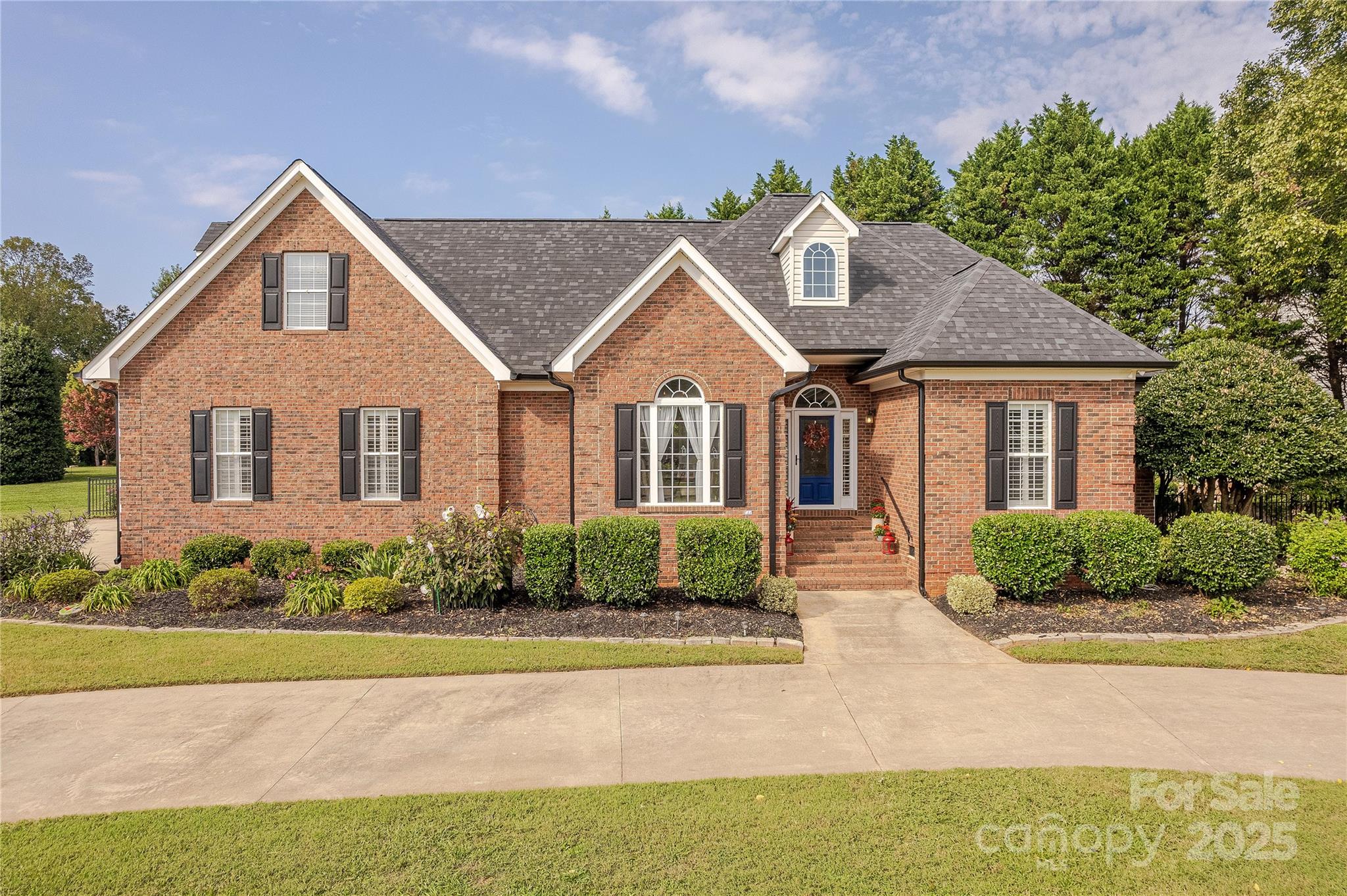 This beautiful brick one-and-a-half-story home perfectly blends elegance and comfort with 4 bedrooms and 3 full bathrooms. Rich hardwood flooring flows throughout the main living spaces, leading into a bright white kitchen complete with granite countertops, a tile backsplash, and a spacious butler’s pantry offering exceptional storage. The dining room is a true showpiece with vaulted ceilings and striking beam details, adding warmth and character.The second floor features a spacious flex space as well as another full bathroom.

The outdoor living is nothing short of an oasis. An expansive paver patio and winding pathways lead to an in-ground pool with cascading waterfall features, a tranquil stone koi pond, and a charming pergola. A relaxing hot tub completes the retreat, making this backyard ideal for both entertaining and quiet escapes.