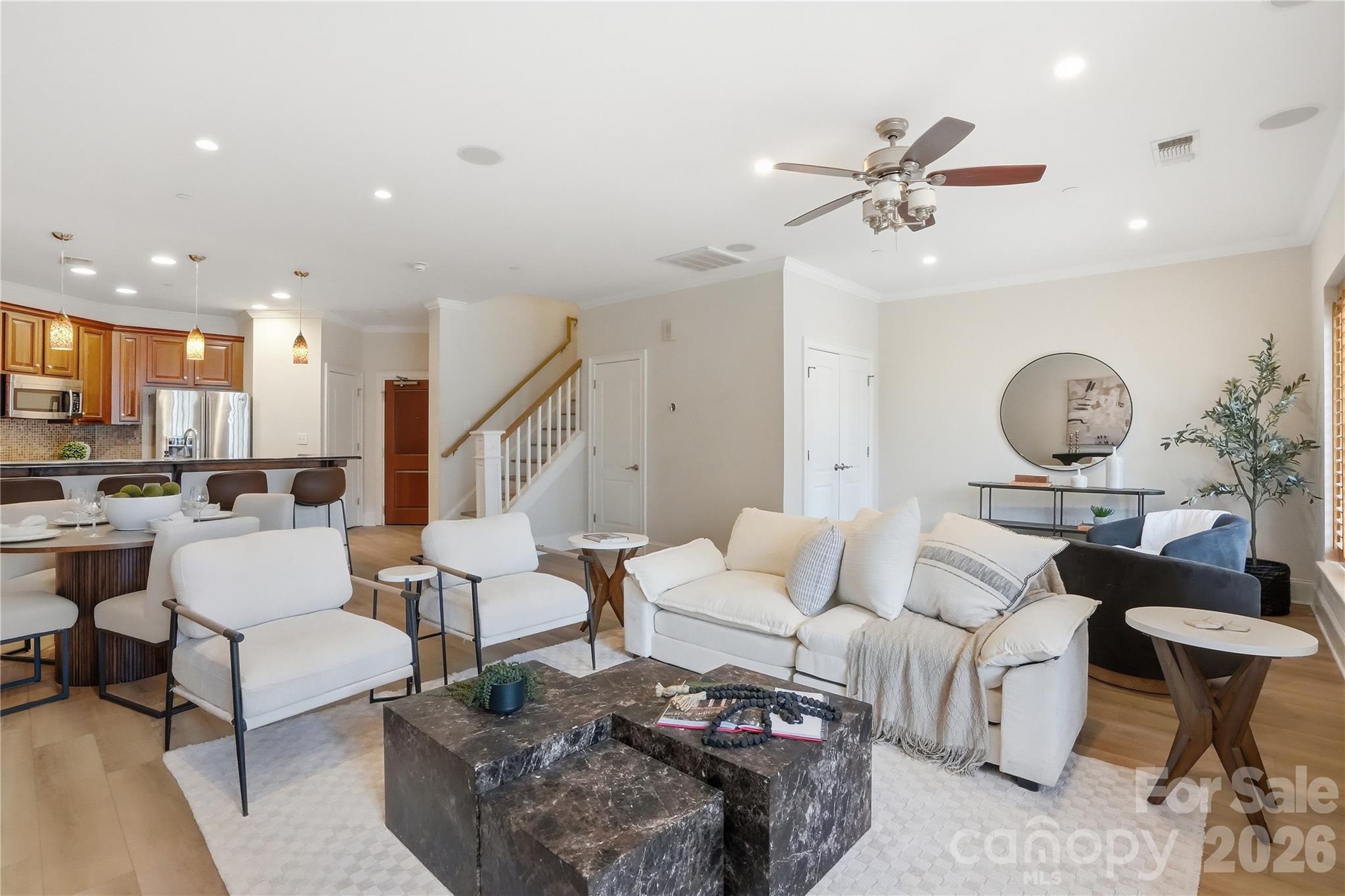 Luxury Uptown Living in the Heart of Fourth Ward! This beautifully updated condo offers the perfect blend of style, convenience, and city views in one of Charlotte's most desirable neighborhoods. The wide-open main living area features brand-new luxury vinyl plank flooring and fresh paint throughout, creating a bright, modern, move-in-ready space. The well-appointed kitchen boasts granite countertops, stainless steel appliances, and seamless flow into the spacious dining and living areas. Enjoy custom touches including plantation shutters, a built-in window seat with storage, and views toward Uptown.
Upstairs, you'll find two generously sized bedrooms and two full baths, including a private owner's suite with a walk-in closet and en-suite bath. Both bedrooms showcase stunning city views. Additional updates from the prior owners include a 2020 HVAC system and recently replaced range. Residents enjoy one secure gated parking space, a dedicated storage unit, and access to the building's fitness center. Located just steps from Fourth Ward Park, green spaces, dining, entertainment, and everything Uptown Charlotte has to offer, this is city living at its finest. Welcome home!