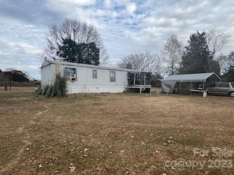 Nice location near all the amenities and No City Taxes! 2 bedroom/1 bath singlewide manufactured home sitting on 1.82 Acres. Workshop with electricity as well as separate storage building to convey. Home needs TLC; sold As-Is.  Come see today!  MAKE OFFER!