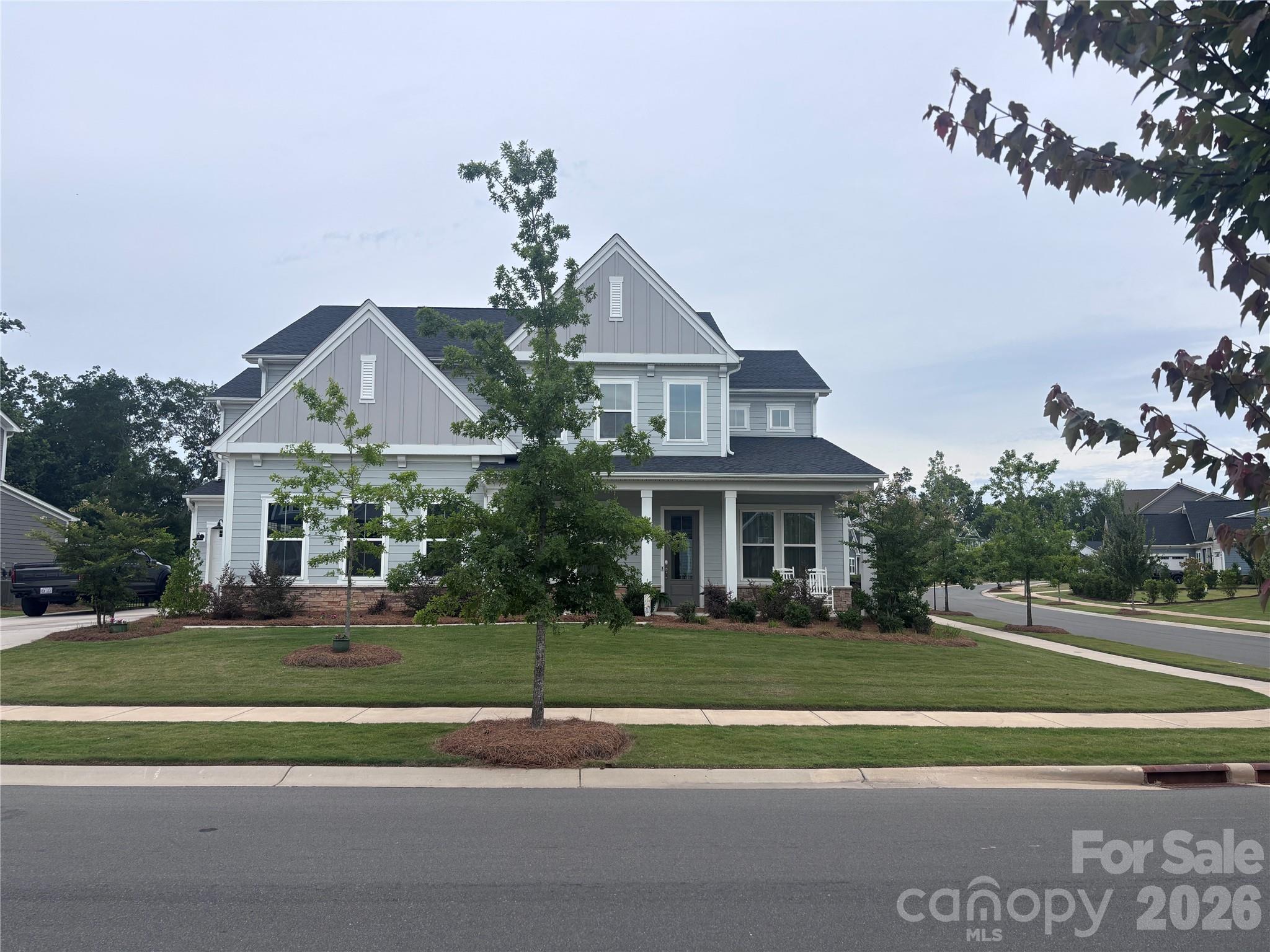 Showings Begin Saturday 06/20/2026 - 10:00 AM. Professional Pictures to be added on 6/20/2026
Homeowner did extensive upgrades during the build.

Welcome to 233 Lanyard Lane in the highly desirable McLean South Shore community, where luxury living, outdoor recreation, and everyday convenience come together. This like-new, meticulously maintained 5-bedroom, 4.5-bath home offers the perfect opportunity to enjoy modern construction without the wait, uncertainty, or added expense of building new. Situated on a spacious 0.27-acre corner lot, this exceptional property offers both room to spread out and enhanced curb appeal.
Designed with both style and functionality in mind, the gourmet kitchen is the heart of the home, featuring stacked cabinetry, soft-close doors and drawers, pull out shelving, quartz countertops, designer pendant lighting, a gas cooktop, wall oven, and abundant storage. Expansive windows and an open-concept layout flood the living spaces with natural light, creating an inviting atmosphere ideal for both everyday living and entertaining.
The luxurious primary suite serves as a private retreat, complete with a spa-inspired bath featuring a freestanding soaking tub, frameless glass shower, dual vanities, and a spacious walk-in closet that conveniently connects to the laundry room. The laundry room is thoughtfully equipped with built-in cabinetry and a utility sink for added convenience.
Upstairs, a generous loft provides flexible living space perfect for a media room, home office, fitness area, or playroom. The home's versatile floor plan includes two bedrooms with private en-suite baths—one on the main level and one upstairs—making it ideal for guests, multigenerational living, or extended stays. Every bathroom showcases full-height tiled shower and tub surrounds, reflecting the home's attention to detail and quality finishes throughout.
Step outside to the covered rear porch, an ideal extension of the living space, featuring a beautiful gas fireplace with ceramic logs—perfect for enjoying cool evenings, entertaining guests, or relaxing year-round while overlooking the backyard.
 Just a short stroll away, you'll find Drift on Lake Wylie and Morningstar Marinas Lake Wylie, offering dining, boating, and waterfront enjoyment right in your neighborhood.
Residents of McLean South Shore enjoy exceptional amenities, including a resort-style pool, clubhouse, playground, lake access with kayak launch, and direct connections to the Carolina Thread Trail and only 2 miles from Daniel Stowe Conservancy where you can experience some of the region's most beautiful outdoor spaces.
Move-in ready and thoughtfully designed, 233 Lanyard Lane offers the perfect blend of luxury, comfort, nature, and location in one of Belmont's most sought-after communities.
5 Bedrooms | 4.5 Bathrooms | Loft | 0.27-Acre Corner Lot | Covered Rear Porch with Fireplace | Resort-Style Amenities | Short Distance to Dining & Marina