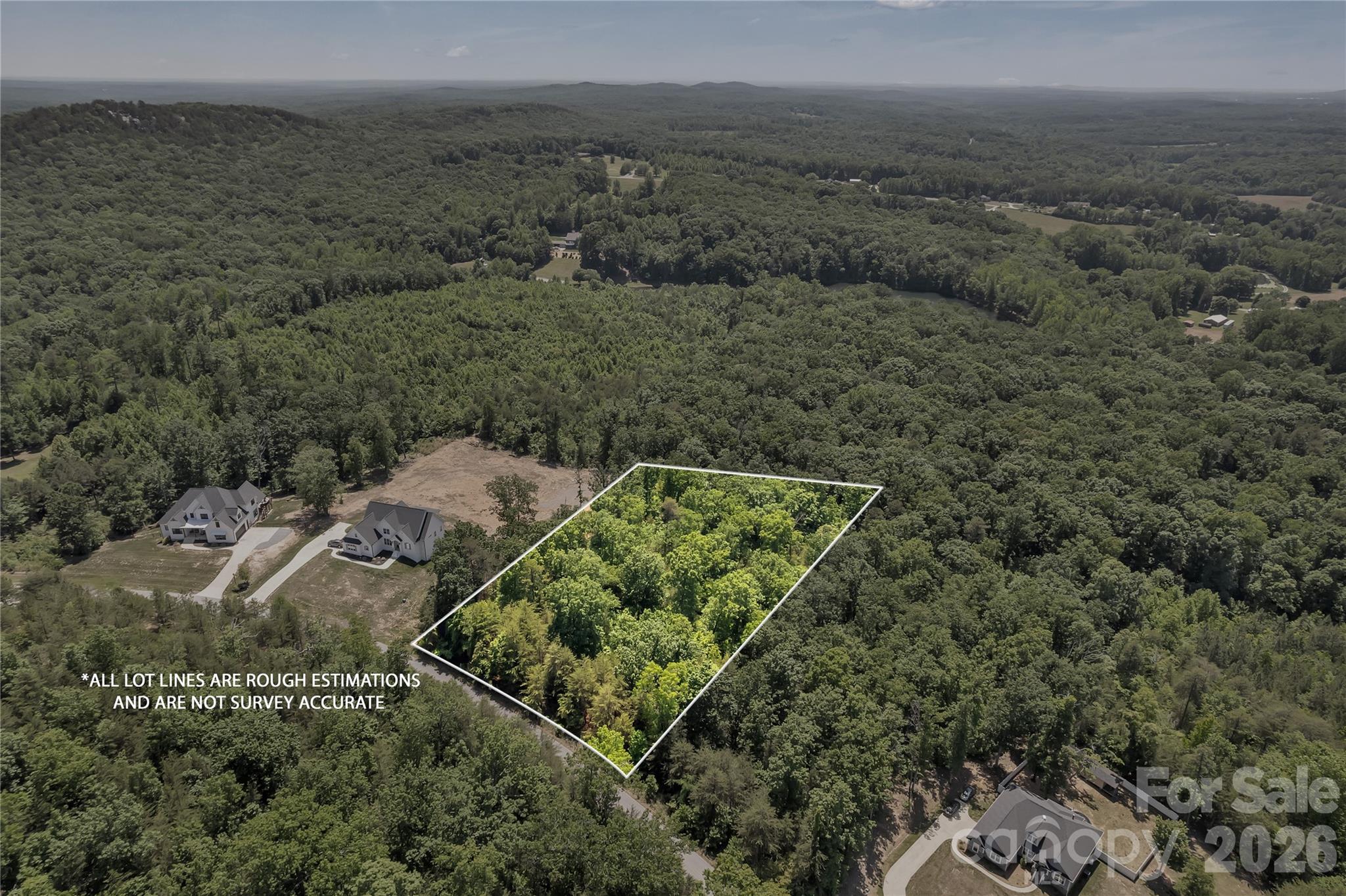 Secure peace of mind and long-term equity with this 1.84-acre homesite at 523 Alex D. Owens Dr. Backing directly to protected Crowders Mountain land, your views—and privacy—are permanent. No future backyard development, just a natural sanctuary.

The lot offers a wide, balanced shape for true design flexibility—ideal for a custom home. Surrounded by established luxury homes and a 2,000+ heated sqft minimum, the neighborhood is built to protect value.

Enjoy quiet foothills living just minutes from the expanding Catawba Two Kings Casino. Easy access to I-85 and Charlotte makes this a rare blend of privacy and smart investment.