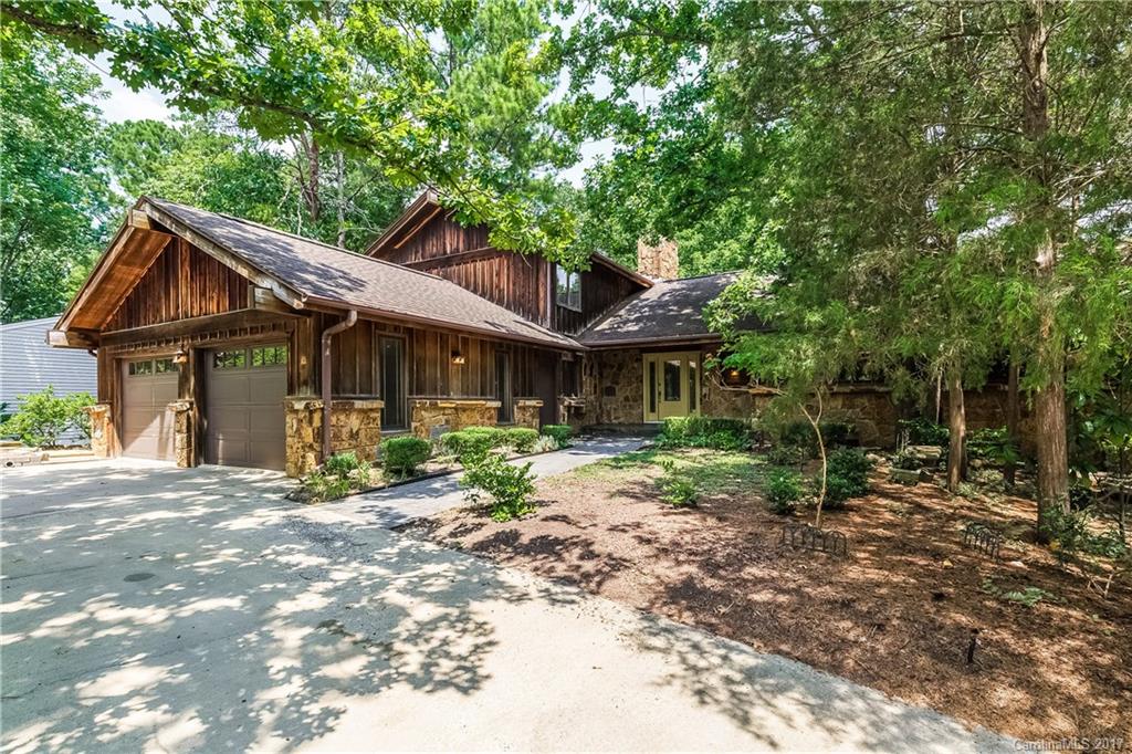 Custom built cedar and Arkansas Stone one-owner contractor home exudes quality craftsmanship.  Main and lower levels open onto large deck and pool area, wonderful for entertaining.  Features include continuous hot water; centralized vacuum; large eat-in kitchen with two ovens, granite countertops, and custom cabinets; abundant storage; bedrooms on each level; walk-out basement with self-contained shop with separate entrance; Pella windows; and a natural, landscaped yard with circular drive.