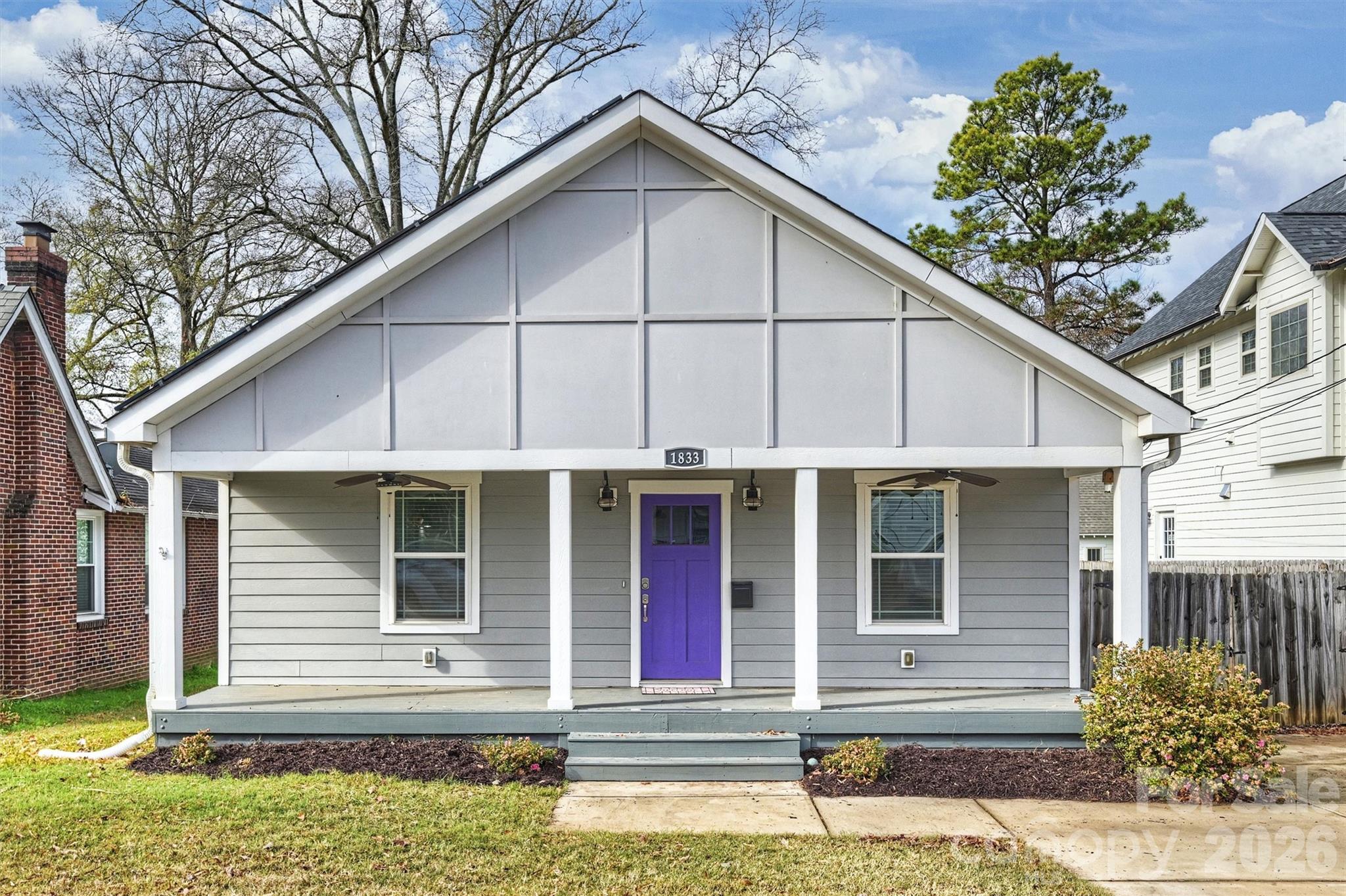Picturesque 3BR/2BA bungalow living in the vibrant Villa Heights community. Delivering impeccable curbside appeal, this lovely haven is move-in ready and comes with the bonus of no HOA fees. The inviting front porch welcomes you in. Ideal for both entertaining or relaxing, enjoy the open floor plan designed for modern one-level living. The generous living and dining area is highlighted by high ceilings, oversized windows, and rich hardwood floors. The stylish island kitchen boasts ample gray shaker cabinets, a large walk-in pantry, and stainless steel appliances. The split bedroom floorplan offers both family access and privacy, with the primary suite overlooking the serene back yard. Rounding out this storybook home, step outside to enjoy your private backyard retreat. The landscaped fenced-in backyard with a large deck, brick patio and shed provides a lovely space for summer outdoor gatherings. Additional updates that add value to this home include newer solar panels, and maintenance management. Your forever home awaits.