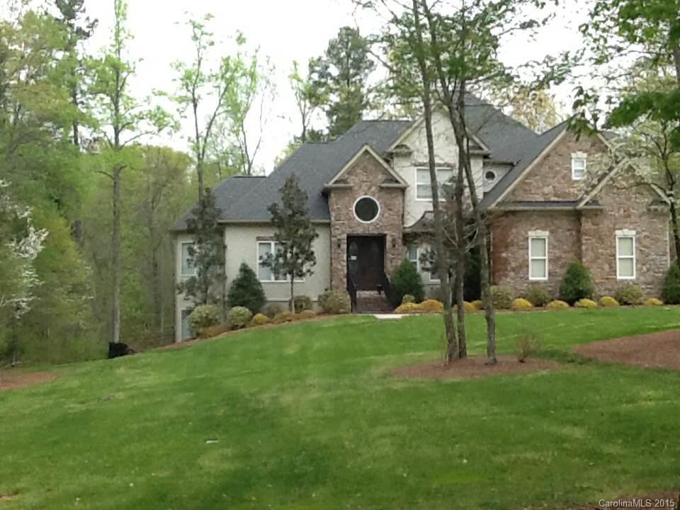 Stately home on 4.5 acre "equestrian approved" lot in desirable Lakeview Landing. 1st floor master suite, recently updated kitchen with SS Electrolux appliances, granite, breakfast area plus walk-out terrace with secluded, wooded view. Second floor features 3 large bedrooms and 2 full baths. Lower level features large bedroom, bonus/media room, full bath with jetted tub, a large shop area already wired with work benches and an enormous storage area. A little TLC and this home is a show stopper.