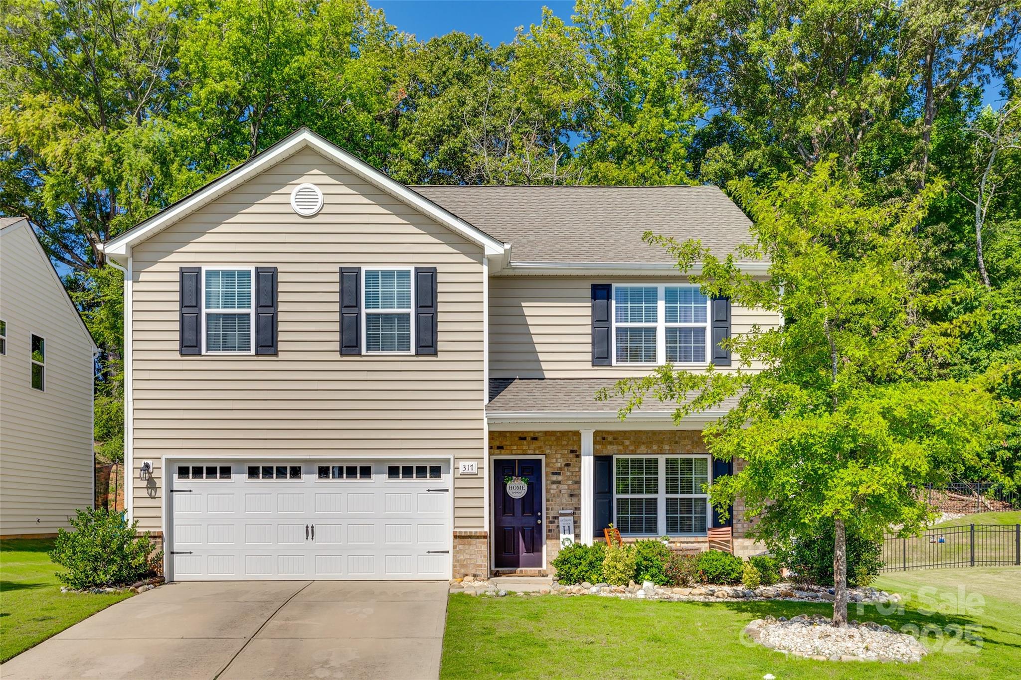 Come make this 5 bedroom residence home. Highlighted by a main floor bedroom and an expansive open concept floor plan, this home offers seamless transitions between living and entertaining spaces. Yards of countertop and cabinets in the kitchen with a center island and stainless steel appliances in the kitchen. Upstairs additional secondary bedrooms and an owner's suite, providing ample space for relaxation and privacy. A large extended patio with with a fully fenced yard l is a must see for this property. Located in award winning Fort Mill School district, this neighborhood's location is an absolute perk being close to Anne Springs Close Greenway, Catawba River and downtown Fort Mill, minutes from Lancaster and highway access.