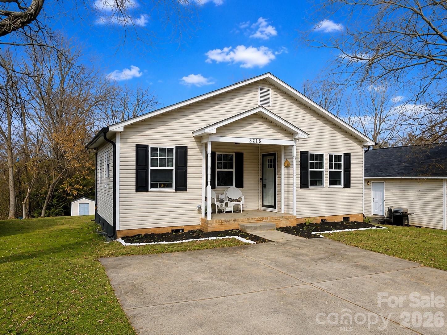 Owner-occupants only!  MOVE-IN READY! Cute 3 BR/1.5 Uptown bungalow with a large front porch and new landscaping.  Upgraded interior with trendy fixtures, laminate flooring, fresh paint, and new doors!  Open floor plan with galley kitchen, stainless steel appliances, and lots of natural light shining in.  Located at the end of a street with no through traffic, the home has a peaceful cul-de-sac feel.  Neat porch off of primary bedroom to take in the wooded back yard.  New gutters installed and features a backyard shed for additional storage.  Habitat for Humanity has first right to buy the home (they have declined prior to listing) and it is deed-restricted to owner-occupants only until 2030 (no investors can buy it until then).  Great, move-in ready affordable home opportunity for owner-occupants in a high potential Charlotte growth area- must see!