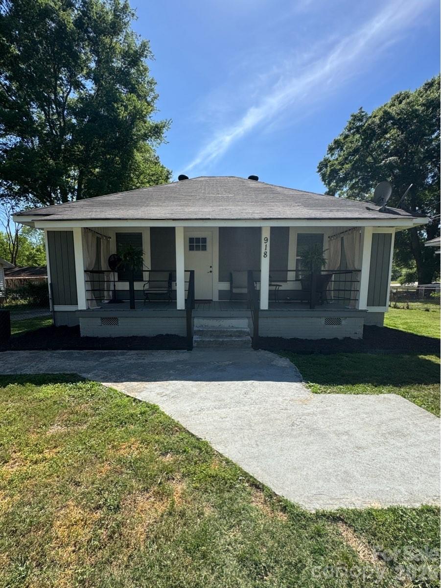 CONFIRMED Assumable Loan with an Annual Percentage Rate of 3.25%!!! Move-in ready and fully renovated, this charming Arts & Crafts-style home is just minutes from downtown Lancaster and packed with modern upgrades. Featuring 2 bedrooms, 2 bathrooms, and over 1,100 square feet of single-level living, this home offers both style and functionality.

The open-concept layout creates a bright, airy feel, seamlessly connecting the living room and kitchen—perfect for entertaining. The kitchen is the heart of the home with a large island, updated appliances, and modern finishes, all complemented by durable luxury vinyl plank flooring throughout.

The primary suite provides a private retreat with a walk-in closet and full bath, while the second bedroom is ideal for guests or a home office. A dedicated laundry room adds convenience.

Outside, enjoy a covered front porch and a large, fenced backyard with a level lot—perfect for outdoor living, pets, or future customization. All located near shopping, dining, and just a short drive to Charlotte via Hwy 521!