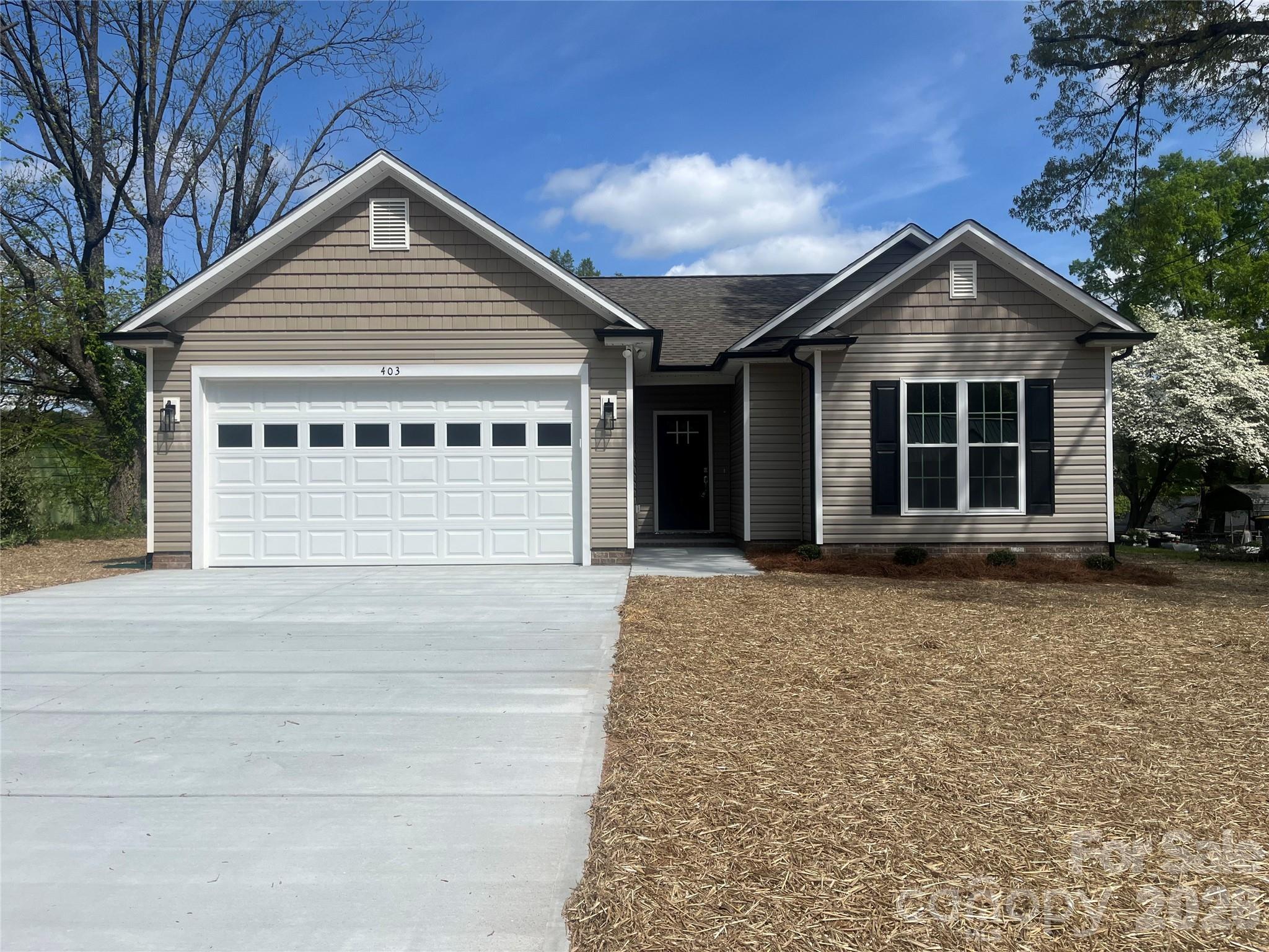 COMPLETED NEW CONSTRUCTION IN KANNAPOLIS – NO HOA. This custom-built home features 9’ ceilings and Luxury Vinyl Plank (LVP) flooring throughout. The kitchen is equipped with custom Eudy’s cabinets, granite countertops, tile backsplash, a center island, and a pantry. An extensive interior trim package includes tall baseboards, large door and window casings, picture frame moldings, 2-piece chair rail, and built-up crown moldings. Flex-use niche. The primary suite offers a large bedroom and a spacious bath with tall Eudy’s vanities, dual sinks, granite countertops, a garden tub, a separate tiled shower with a glass enclosure, and a walk-in closet. All bathrooms feature Eudy’s custom cabinetry and granite countertops. Exterior features include maintenance-free vinyl siding, an oversized concrete driveway, and an oversized rear patio. 2-car garage with keypad entry. Listing agent is the builder and owner. Tax value reflects the lot only.