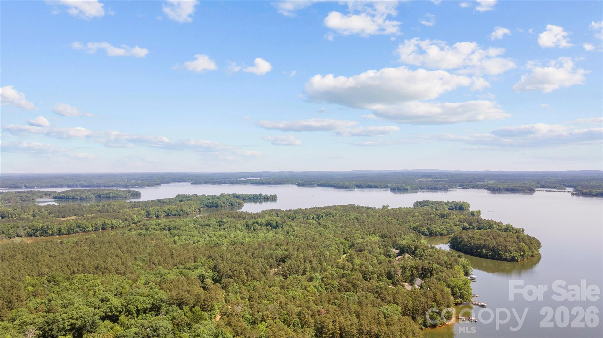 Beautiful waterfront lot on High Rock Lake's premier development, Emerald Bay. Emerald bay offers a peaceful setting backing up to the Eagle Point Nature Reserve. This tranquil waterfront lot has a deeded boat slip (#41), secure boat storage, and a boat lunch. Bring your builder or I can refer you to one, no required build time. Septic permit in place and valid through 2027.