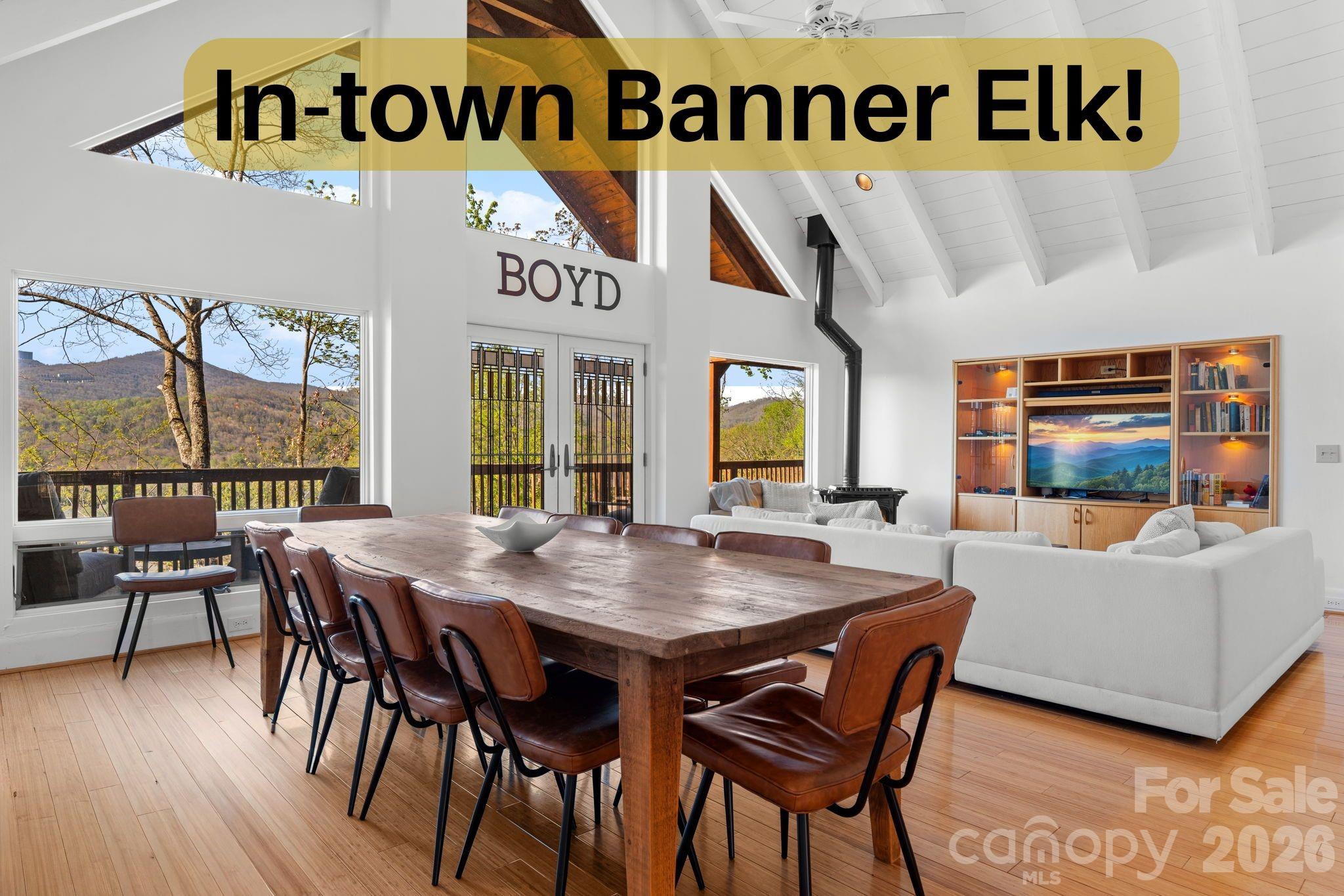 Perched just above the charming town of Banner Elk, this spacious home delivers the best of mountain living — peaceful enough to hear the leaves rustle, yet close enough to hear the music drifting up from the town park on Thursday summer evenings. In winter, skiing at Sugar Mountain and Beech Mountain awaits just 15 minutes away. Year-round, downtown Banner Elk's shops and restaurants are less than half a mile from your door. Arrive to ample parking and take just four easy steps up to the main level — single-level living if desired. The full-length rocking chair front porch sets the tone immediately, welcoming you to the mountains. Step inside to soaring vaulted ceilings and an open-concept living, dining, and kitchen area finished in a white-washed style that brings a fresh, modern feel. The kitchen offers a generous island with breakfast bar seating. There is a comfortable living area and a large dining table to seat everyone. And yes, the home is offered fully furnished, with just a few exceptions. The main level follows a split floorplan. On one side, the spacious primary suite features a bright, beautifully renovated bath and en-suite laundry — plus direct access to the full-length back deck, where views over the town of Banner Elk await. On the other side, two additional bedrooms each open to the front or back deck, and share a well-appointed bath. Every bedroom is genuinely spacious; no one draws the short straw here. The lower level offers tremendous flexibility — a huge living area, a fourth bedroom with seating area, and two full baths give guests or family members a retreat of their own- including a separate entrance from the driveway. On the lower back deck, you’ll find a concrete slab and wiring already in place for a hot tub. The oversized, attached two-car garage opens to this level. The owners have taken exceptional care of the home: a new roof (2019), sanded and stained (2020), new retaining wall and 1,000 gallon propane tank (2020), repaved driveway (2022), new water heaters (2026), a new A/C compressor (2026), and more! No HOA, and the home is on city water and sewer and a city maintained paved road. This home is move-in ready and built to last. Whether you're looking for a full-time mountain home, a vacation retreat, or an income-producing rental property, this home checks every box. When you can't be here — and you'll always wish you could — the rental potential is excellent.