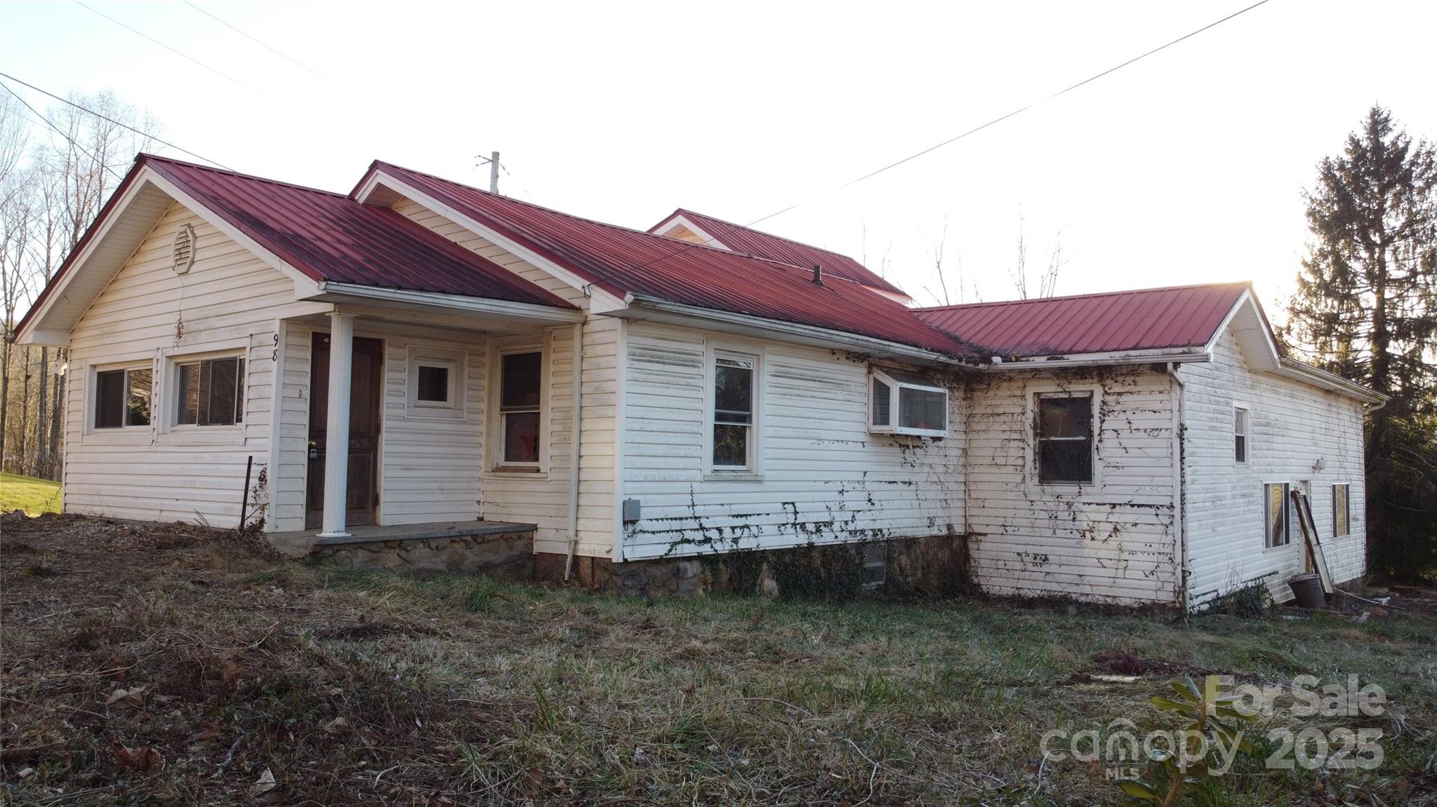 Opportunities like this don’t come along often in Candler. Set on a level half-acre in the heart of Hominy Valley, 98 Lower Glady Fork Road is a true value-add property for investors, renovators, or vision-driven buyers looking to unlock serious upside.

Originally a 1930s bungalow, this home has evolved over time, most notably with the addition of a large great room that opens the door to multiple reconfiguration options. With a full rehab, the layout lends itself well to conversion into a duplex or multi-unit setup—think a spacious efficiency or loft-style unit paired with a separate 3+ bedroom residence. The bones are here; it’s ready for someone to reimagine it.

The setting only strengthens the case. The property sits level and usable, a rare find in this area, and is convenient to the Blue Ridge Parkway, Mt. Pisgah, Candler, West Asheville, and Canton—locations that consistently support strong rental demand and long-term appreciation.

This is not a cosmetic project. It’s a from-the-studs-up opportunity for the buyer who understands how to create value through thoughtful renovation and strategic design. Whether your end goal is income production, resale, or a creative live-work setup, this property offers the flexibility and location to make it happen.

If you’re looking for turnkey, this isn’t it.
If you’re looking for potential, position, and upside—this one deserves a closer look.