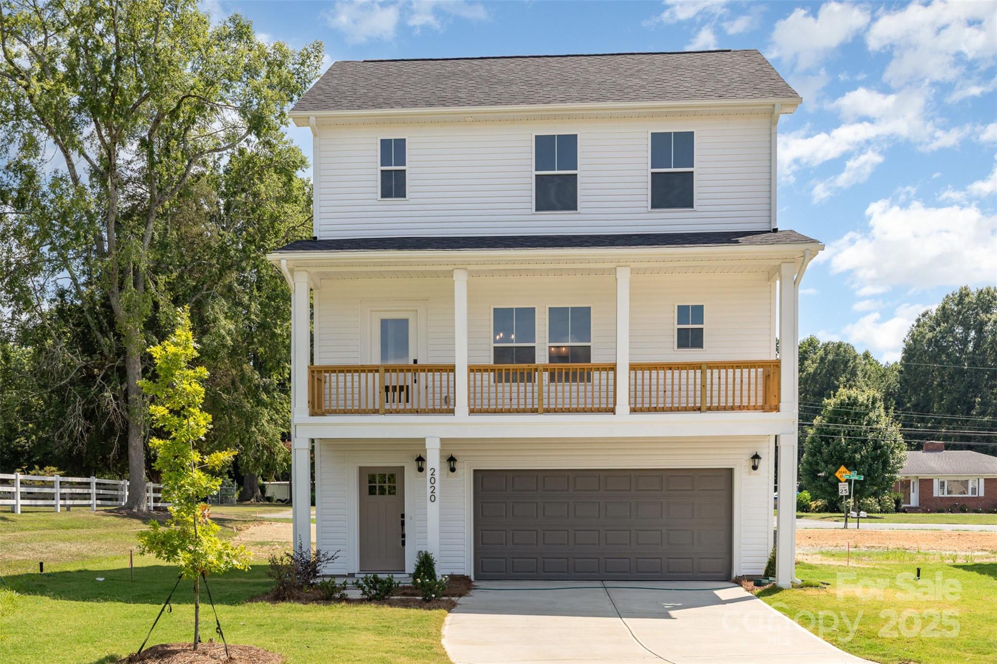 Price just reduced 10K!! $10,350 in closing cost credits with preferred lenders. Last Banyan now available in Sadler Village! The brand-new floorplan includes 3 bedrooms, 3 full baths, exterior deck off of the living room & double-car garage. Gorgeous SPC flooring throughout main floor seamlessly connects living, dining & kitchen areas. Beautiful exterior deck off of the living room. Kitchen features soft-close, dovetail shaker cabinetry & quartz countertops paired with tile backsplash that shines next to the stainless-steel appliances. One bedroom & full bath on main floor. Primary suite, another bedroom & 2 more full baths located on the 3rd floor! All full bathrooms have beautiful quartz countertops atop shaker, soft-close cabinets & framed mirrors. The practical third floor laundry room boasts a recessed dryer vent. Sadler Village is located just 10 minutes from Charlotte airport & 15 minutes from Uptown.