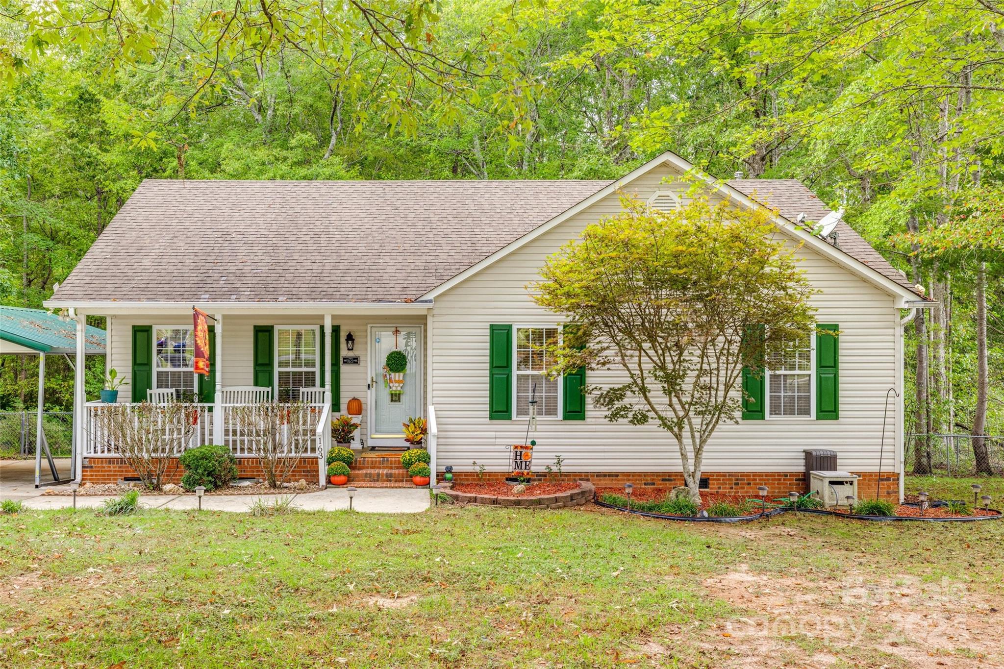 Welcome to 163 Scotch Pine Drive! This well-maintained 3 bedroom, 2 bathroom ranch style home features a cozy living room with a gas fireplace. Inside, you'll find fresh paint throughout, new carpet in the bedrooms, and new LVP flooring in the bathrooms. The living room and foyer boast engineered hardwood floors and updated lighting throughout the home. Step outside to the freshly painted deck, which overlooks a fenced-in yard and a serene wooded lot—ideal for entertaining. Two storage buildings to convey. The green and beige storage building and the dog fence does not convey. With no HOA, enjoy the freedom of this peaceful community. Located conveniently near downtown York, you're just minutes away from shopping, dining, and all the local amenities. This home is truly move-in ready—all it needs is your personal touch to make it yours! The roof, though with no known issues, is scheduled for replacement in October 2024.