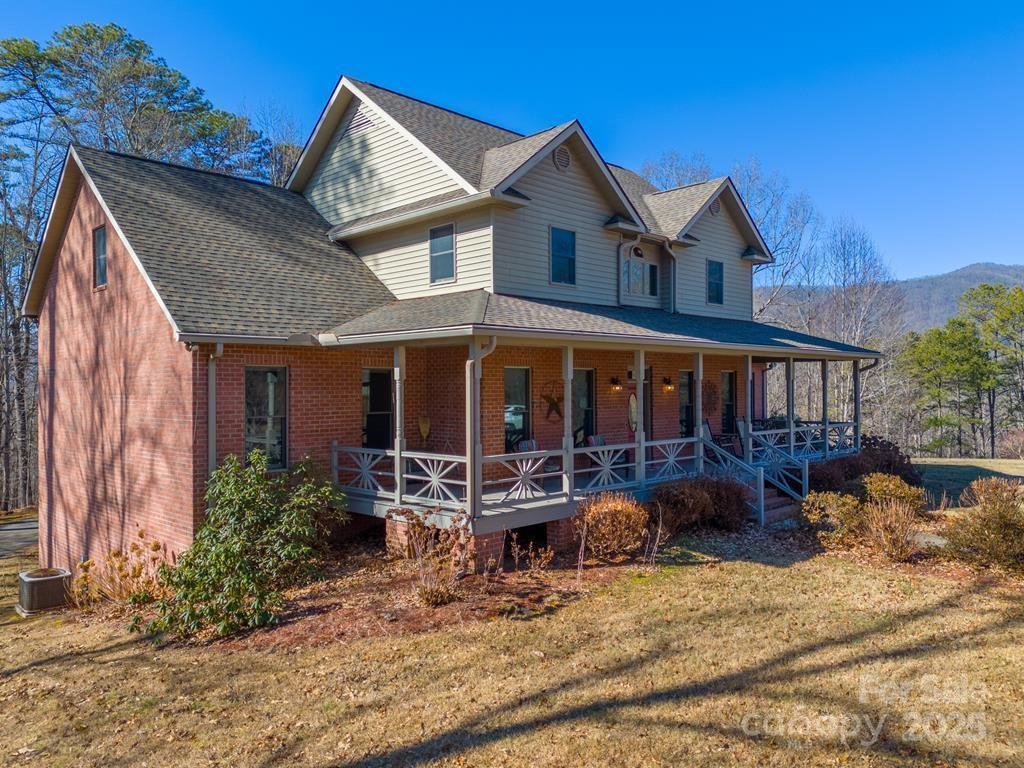 Located just outside the city limits with convenient access to the hospital, shopping, and dining, this meticulously maintained estate offers privacy, space, and comfort on 4.45± usable acres with seasonal mountain views. The 4-bedroom, 4.5-bath home welcomes you with oak hardwood floors, abundant natural light, and a striking stacked-stone fireplace anchoring the main living area. The kitchen features cathedral ceilings and an open, airy design ideal for both everyday living and entertaining. The main level primary suite is a true retreat, complete with a spacious bath offering a jetted tub, walk-in closet, and dedicated dressing area. Upstairs, you’ll find an office, three additional bedrooms, a bonus room, and access to a private deck. The finished basement expands the living space with a large living area and multiple bonus rooms, perfect for guests, recreation, or a home gym. Outdoor amenities abound, including a detached flex space ideal for entertaining, a heated detached two-car RV garage with workshop and full bath, a heated driveway, and a fenced backyard for pets. With ample room to gather, relax, and enjoy the outdoors, this exceptional property truly has it all!