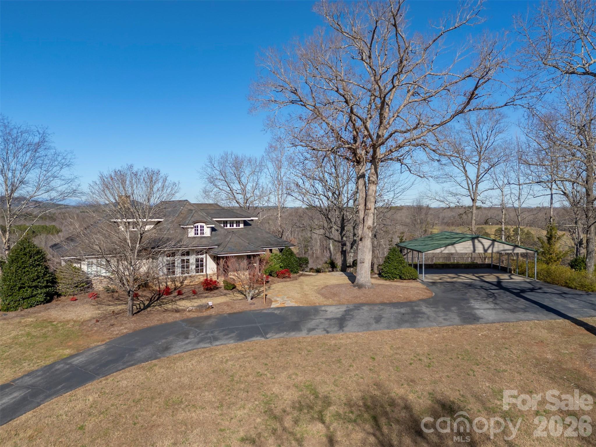 Discover the ultimate Horse Country lifestyle on this remarkable 92+ acre property, boasting over 4,000 square feet of living space and breathtaking long-range views. The impressive post and beam great room with soaring high ceilings sets a warm, inviting tone, while the charming inground pool and rock patio create the perfect retreat after a day outdoors. A separate kitchen on the lower level is perfect for entertaining indoors or out. Enjoy approximately 1,900 feet of Hooper Creek winding through your land—ideal for equestrian pursuits or simply savoring nature’s tranquility. With three spacious bedrooms and close proximity to Landrum, Tryon, Asheville, Greenville, and Spartanburg, this farm offers both seclusion and convenience for those seeking a premier country estate. Seize your chance to own an extraordinary piece of Horse Country—schedule your tour today!