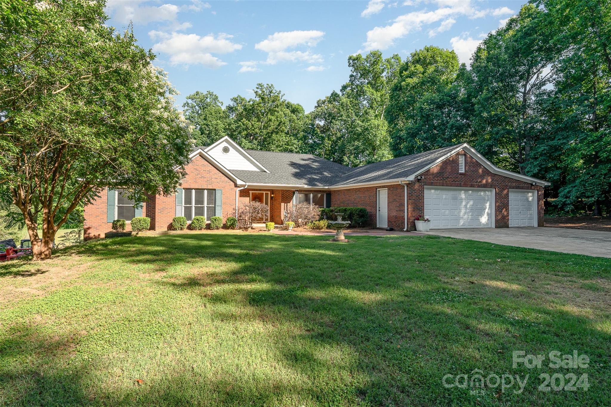 Welcome to a private oasis that is just minutes to the hustle and bustle with NO HOA!  This home sits on almost 2 acres in the city and is every outdoors persons dream!  You also only pay county taxes!  This home boasts 4 bedrooms with a split bedroom floor plan, two living rooms, centralized kitchen and a dining area.  All the carpet has been replaced, the floors refinished and brand new neutral painting throughout.  Roof in 2023.  Don't forget to check out the massive back deck which is great for entertaining! The sellers replaced the roof as well!  If you are a car fanatic this home will be your paradise because you will see that it has a 6 CAR TANDEM GARAGE!  Don't forget to check out the basement workshop on the left side of the house. Come by and take a look at this wonderful home today.