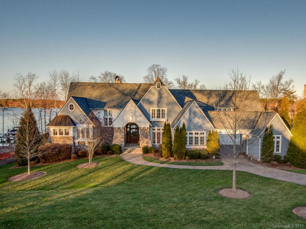 Nantucket Style 3 Level Waterfront Home full of upgrades and thoughtful details. Two story Great Room w/beamed ceiling, Gourmet Kitchen with Top of the line Appliances. Private Baths in each Bedroom. Lake Level Rec Room, Bar, Wine Cellar, Study, Theater, and Exercise. Outdoor space with Spa, Pool, Built in Grill, Private Pier. Spectacular Panoramic views. 4 Car Garage. Home Warranty Included!