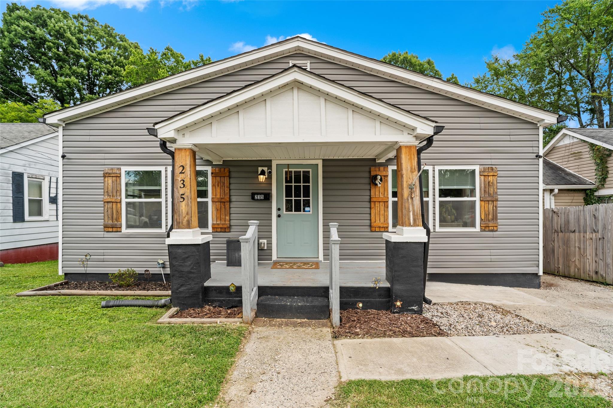 Just a short walk from downtown Concord’s Historic District, this 3-bedroom, 2-bathroom bungalow was stripped to the studs and completely rebuilt in 2022. Inside, a spacious foyer opens to a bright, airy layout featuring 9-foot ceilings and durable laminate flooring. The kitchen is a standout with rich butcher block countertops, custom soft-close cabinets, a shiplap backsplash, and stainless steel appliances. Along with three comfortably sized bedrooms, you get two dedicated parking spots right out front. Best of all, total peace of mind: the plumbing, electrical, HVAC, windows, and vinyl siding were all updated in 2022, and a brand-new water heater was installed in 2025. There are two parking spaces right out front, plus plenty of extra room across the street and in the church lot next door if you need it for guests!