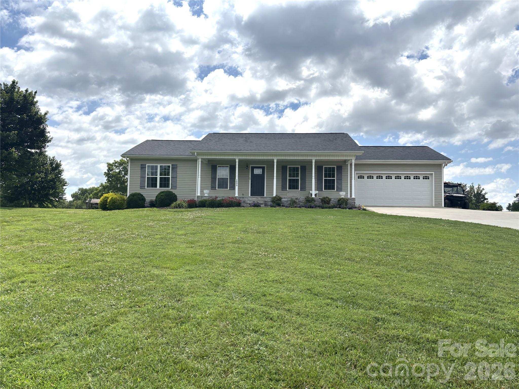 Enjoy the best of both worlds with peaceful rural living just minutes from everyday amenities. This well-maintained one-level home offers 3 bedrooms and 2 bathrooms, combining comfort and convenience in a serene setting. The kitchen features granite counter tops, stainless steel appliances, and plenty of workspace for everyday living and entertaining. Unwind on the screened porch overlooking an expansive, tree-lined backyard that offers privacy and room to enjoy nature. Gardening enthusiasts will appreciate the large garden area, greenhouse, and spacious outbuilding, providing endless opportunities for hobbies, storage, or a workshop. If you're looking for a quiet retreat with modern comforts and easy access to shopping, dining, and schools, this property is ready to welcome you home.