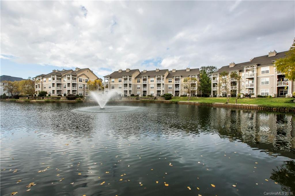 Back on the market after change of plans for renter!!! This gorgeous, top floor condo features vaulted ceilings, updated paint, fresh carpet, new light fixtures and fans, w/d and much more! This home is a must see if you are looking for a convenient location in Lake Norman. Overlook the gorgeous fountain pond and enjoy the many amenities of Admirals Quarters. Walk to restaurants and Robbins Park. Steps from Lake Norman and all the areas attractions. All conveniences and luxuries are close by!