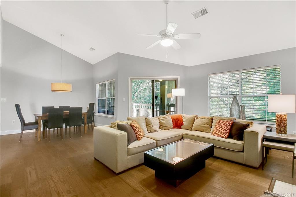 Updated third floor condo in the heart of South Park! This open floor plan unit features vaulted ceilings, large living area with wood burning fireplace and two split bedrooms. Recent updates include new hardwoods, fresh paint in neutral grey and removal of popcorn ceiling. Large outdoor living area with balcony nestled in the trees and exterior storage closet.