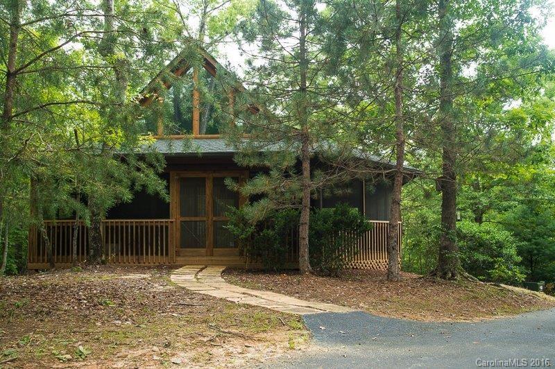Lovely wooded retreat with plenty of privacy. 20.83 acres with cozy log home with open floor plan and wrap around screened porch, perfect for rocking. Property has a marina slip in the Blue Ridge Overlook Marina and adjoins the Lake Adger Equestrians trails. It is approximately 15 minutes from the Tryon Equestrian Center.