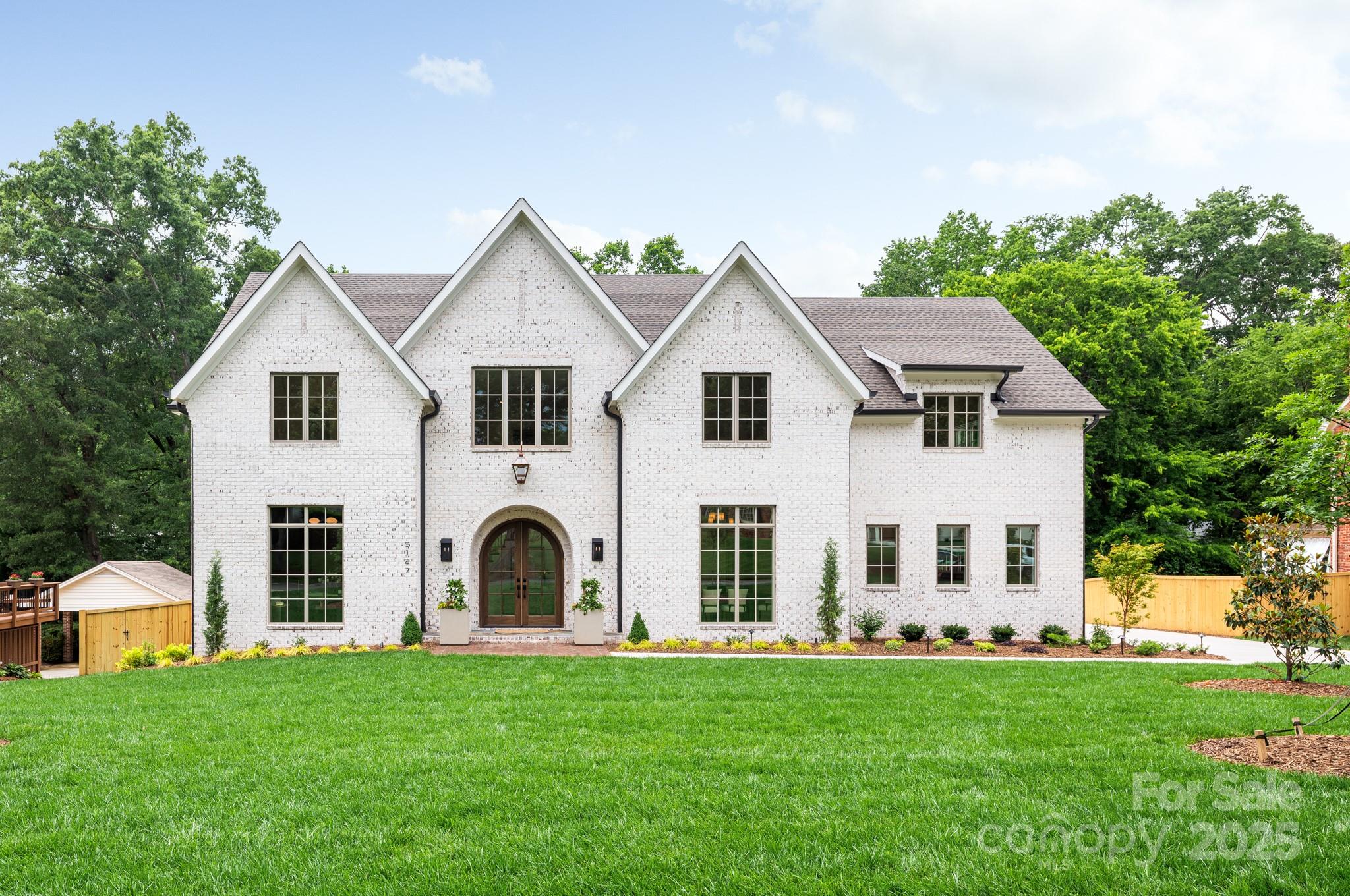 Start making memories in this stunning new construction home built by THR Design Build in hot Lansdowne! Luxury custom finishes greet you as you step inside the beautiful arched double doors into this entertainer's dream home: custom curved staircase, Chef's kitchen with 48' Wolf range w/ custom hood, 48" JennAir frig, and large custom island. Features a Pantry with additional storage, microwave, and 2nd dishwasher and a Butler's Pantry with wine frig and even more cabinetry. Open the sliding glass doors as you relax by the fire in the Great Room or enjoy the fresh air with indoor/outdoor living from the back porch overlooking the beautiful back yard! Main level Primary suite is full of light with a luxurious spa bathroom and custom closet with w/d hookups. Formal dining room, study, breakfast room, and mud round out the main level. Upstairs you will find 4 add'l bedrooms, laundry, and generous bonus room. Beautiful white oak hardwoods in most of this ENERGY STAR home. Welcome home!
