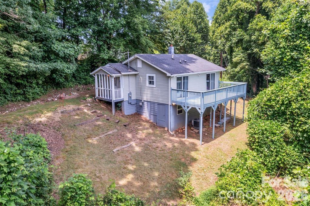 Turnkey 1955 Blue Ridge Cottage  720 Sq Ft on 8,276 Sq Ft Lot | Sleeps 9 
NEW 2026:* Luxury vinyl plank floors throughout, updated bath with new toilet/vanity/sink, fire pit with exterior seating, picnic table, coffee station, fully furnished!

This charming 1955 cottage sits on a spacious 8,276 sq ft corner lot — nearly 1/5 acre of privacy surrounded by trees. Thoughtfully updated while keeping its mountain character. Sleeps 9 with king suite, bunk+trundle room, and queen sleeper sofa in 720 sq ft of smartly designed space.

*Outdoor Living:* Huge covered front porch + full-length private back deck. Fire pit area with exterior chairs for stargazing & s’mores, plus a dedicated coffee station for mountain mornings. Picnic table for dining outdoors. Mature landscaping with seasonal blooms and herbs across your 8,276 sq ft lot.

*Perfect for living or investing:* 1.5 miles to Downtown Marion breweries & restaurants. 5 min to I-40, 20 min to hiking, fishing, kayaking, tubing.

*Move-in ready includes:* All furniture, linens, kitchenware, crown molding, custom blackout drapes, smart thermostat, exterior cameras. Solar porch light, shed + walk-in crawl storage, 2 large closets, parking for 4+.  Schedule your private showing today - this one won’t last!

CLICK ON THE VIRTUAL TOUR ICON TO VIEW THE MATTERPORT VIDEO