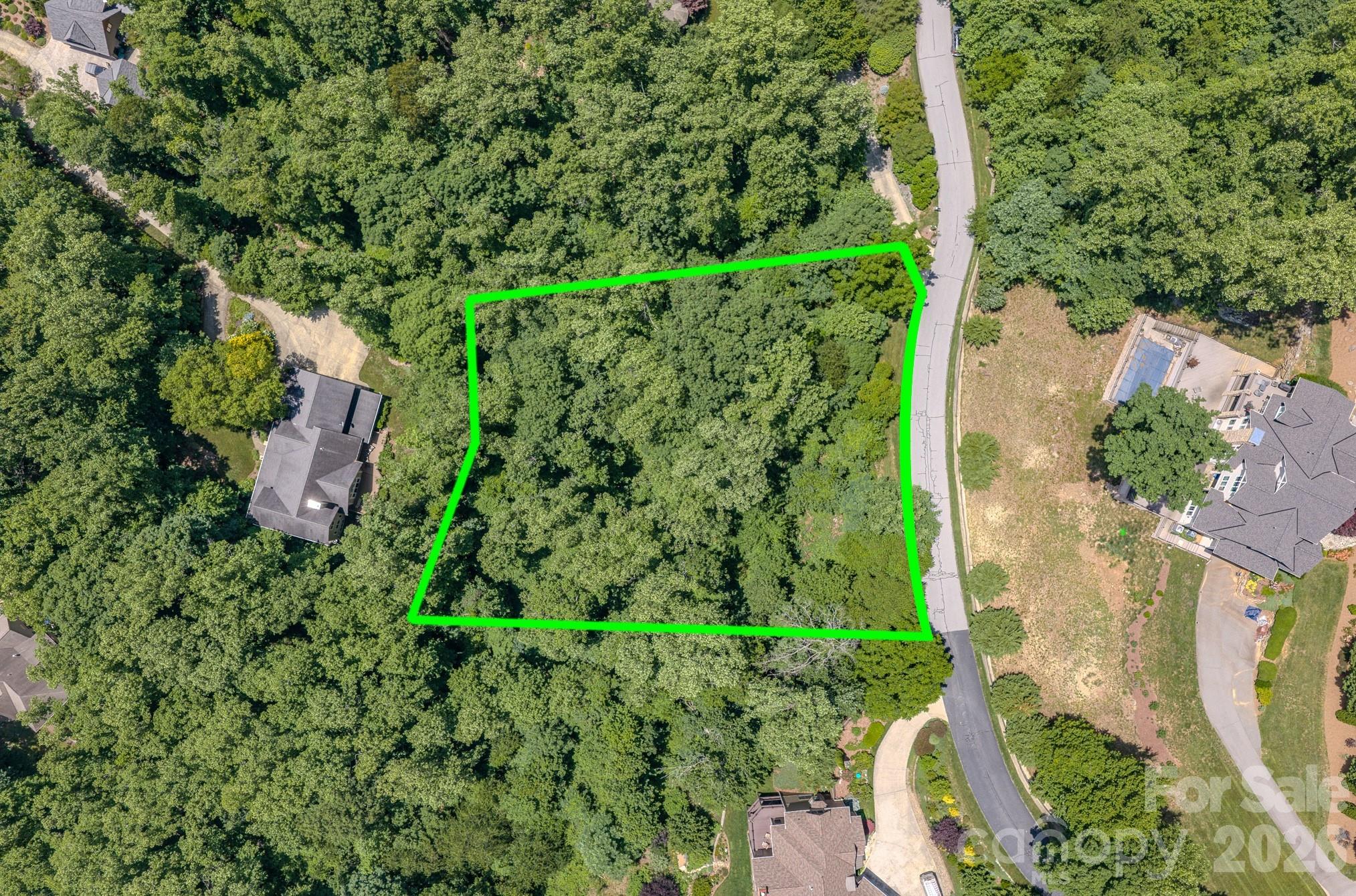 Looking for the perfect canvas for your custom dream home? This gorgeous, wooded 1.05-acre parcel combines private mountain living in this luxury upscale gated mountain community, all just minutes from Asheville’s best features. Incredible potential for unforgettable Blue Ridge Mountain views. Featuring an expired 4-bedroom septic permit. Community Amenities include access to a fantastic playground and scenic picnic areas. Unbeatable Location: South Asheville: 3.7 miles; Asheville Airport: 8 miles; and Downtown Asheville: 11 miles. Build an unforgettable luxury retreat that balances secluded mountain peace with city conveniences.
