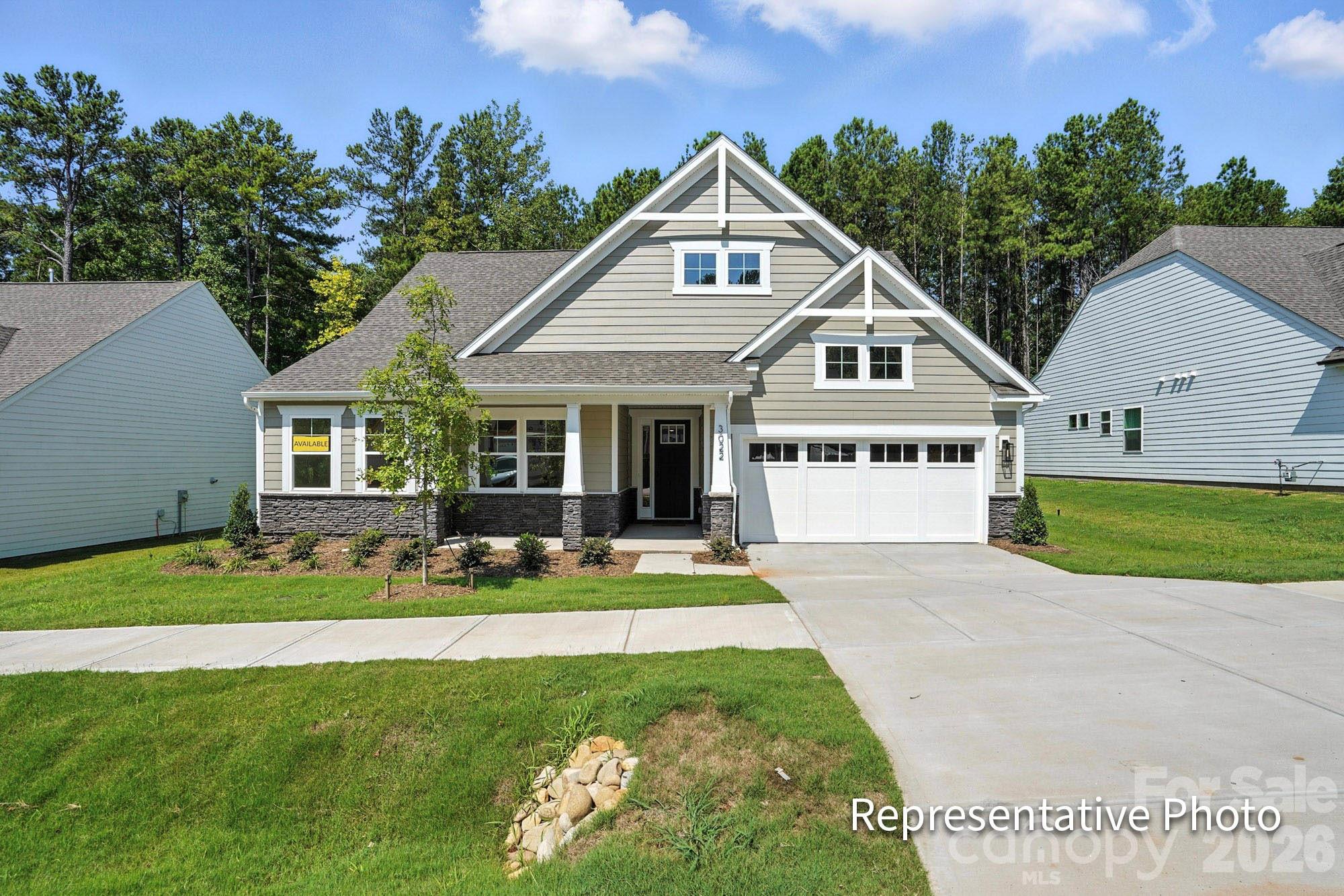 Located in Carrington’s newest phase near Lake Norman, this stunning Sullivan floorplan offers over 2700 square feet with 4 bedrooms and 3 baths designed for both functionality and style. This Sullivan floorplan features a second-floor loft, bedroom, and full bath has space and style to spare! The open-concept kitchen features 42” evergreen designer cabinets with champagne hardware, beautiful quartz countertops, a gas cooktop, and a built-in wall oven/microwave combo. The main-level primary suite includes a luxurious bath with a semi-frameless shower featuring matte black accents and a stylish tile wall surround. A 4-foot shower with a built-in seat adds comfort and convenience in the lower-level guest bath. Colonial-style trim details and a tankless water heater add modern touches throughout the home. Enjoy your time outdoors under the covered porch, complete with an extended patio—ideal for relaxing or entertaining! Community amenities to include pool, pocket parks, & playground.