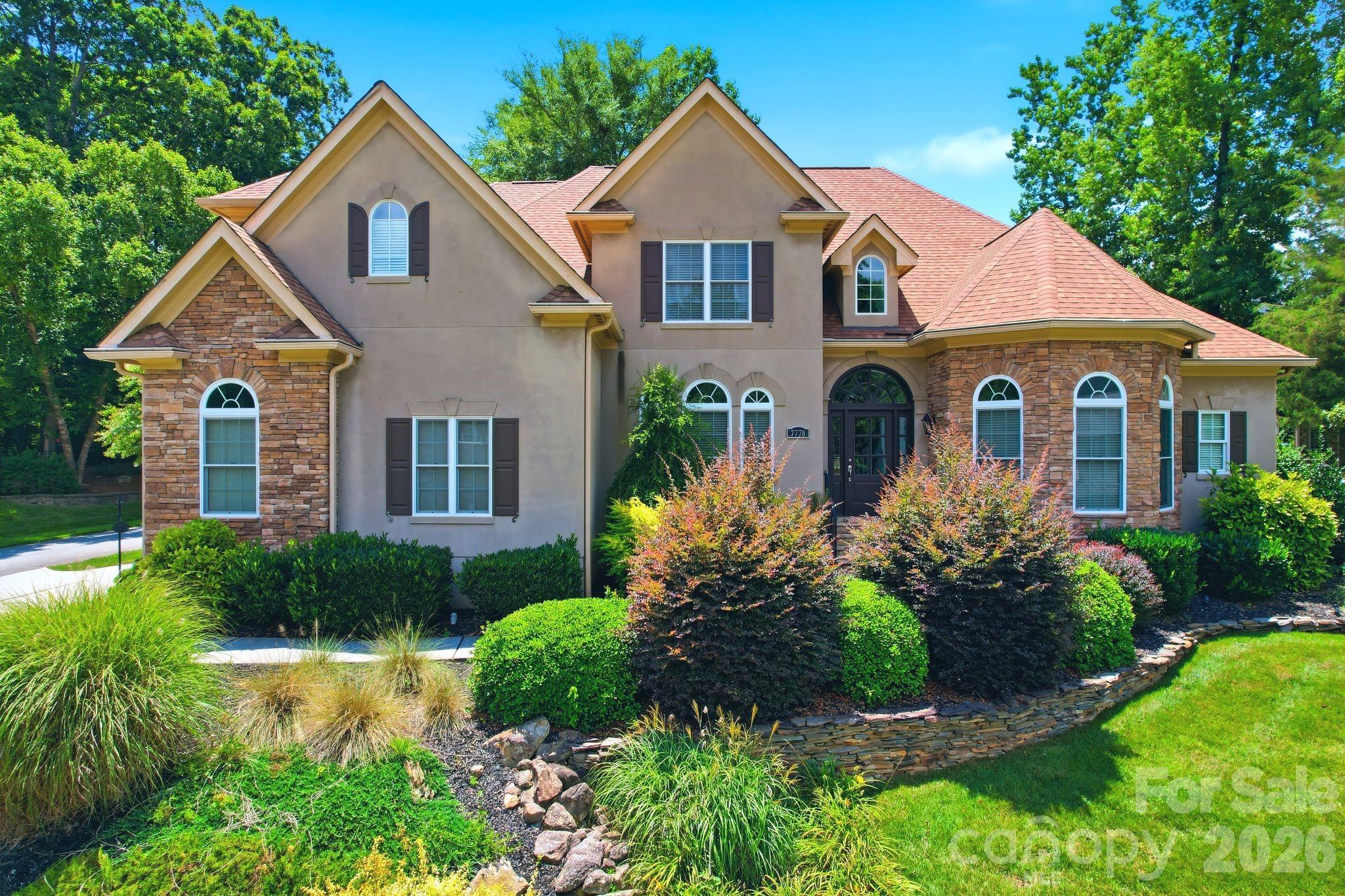 Now offered at a new price, this beautifully updated custom home in Treetops at Cowans Ford offers over 4,100 square feet, 5 bedrooms, 4.5 baths, and a thoughtfully designed floor plan that blends luxury, flexibility, and everyday comfort.At the heart of the home, the refreshed kitchen features crisp white cabinetry, quartz countertops, recessed lighting, and a custom beverage bar, flowing effortlessly into the dramatic two-story great room filled with natural light. Whether you’re hosting a holiday gathering or enjoying a quiet evening at home, the open layout creates a warm and inviting atmosphere.

The main level offers the convenience of a spacious primary suite along with a second bedroom featuring its own en-suite bath, providing flexible space for guests, multigenerational living, or a private home office. Upstairs, you’ll find three additional bedrooms, a generous bonus room, and an open loft overlooking the great room below, offering room for everyone to spread out.

Extensive recent updates include beautifully refinished hardwood floors with a custom stain, fresh interior paint, updated lighting and ceiling fans throughout, and a new upstairs HVAC system installed in 2024, allowing you to move in with confidence.

Outside, the level backyard provides the perfect backdrop for everything from backyard games to entertaining friends, while mature landscaping adds beauty, privacy, and a peaceful setting.

Ideally located near Lake Norman, golf, parks, dining, shopping, and major commuter routes, this home offers the space, flexibility, and lifestyle today’s buyers have been waiting for.

As an added benefit, buyers may qualify for a 1% lender credit when financing through the preferred lender, creating additional flexibility and potential savings. Contact the listing agent for details.