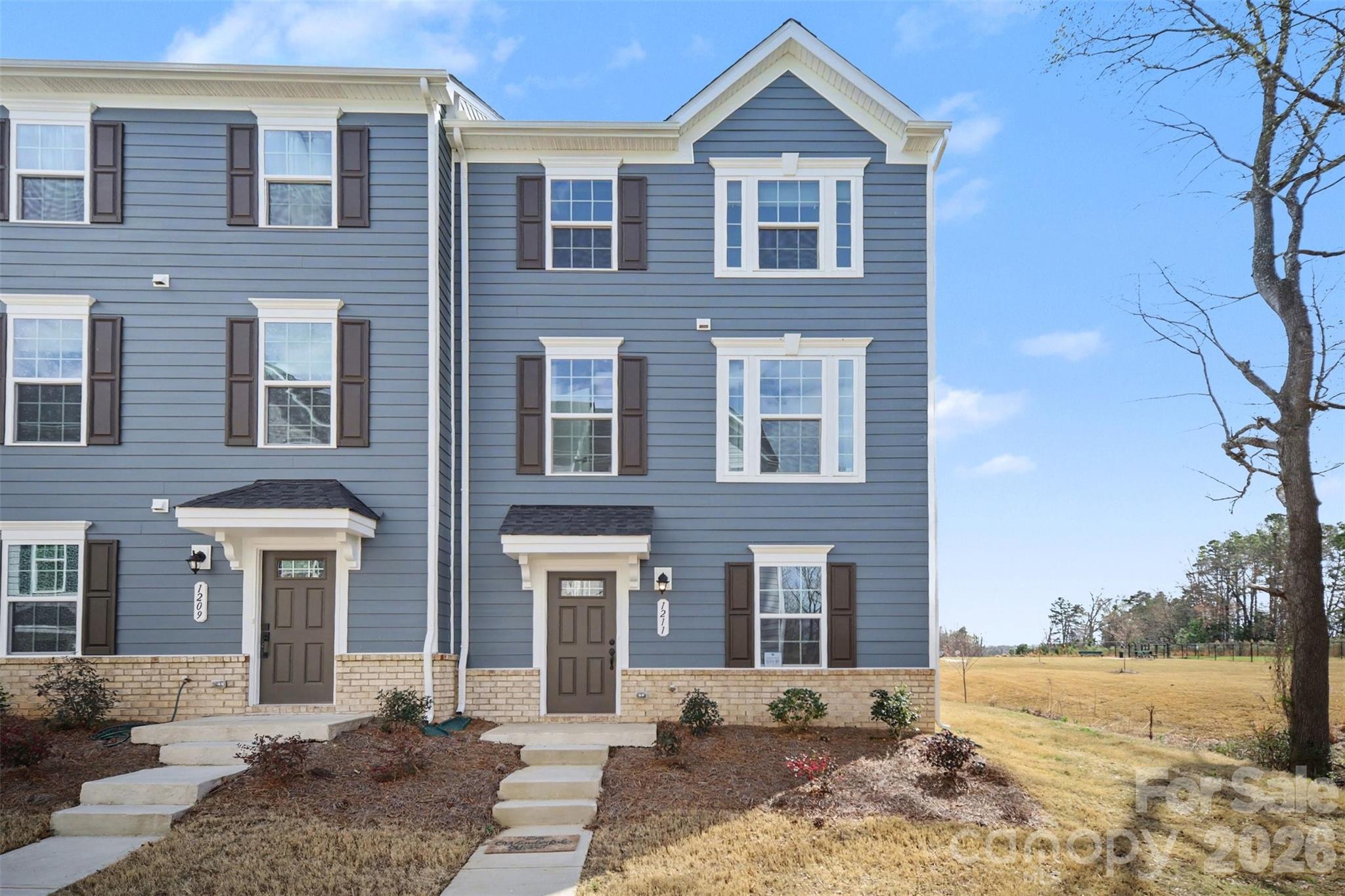 Built in 2024 this beautiful END-UNIT townhome offers extra privacy, great natural light, and a spacious 2,138-square-foot layout designed for easy, modern living. Plus two-car attached garage for added convenience.  Because it’s an end unit, you’ll enjoy extra windows, added privacy, and an open, airy feel throughout. The open-concept living space offers a designer kitchen with an oversized island, sleek stainless appliances, and plenty of cabinet space. It flows right into bright living and dining areas that are perfect for everyday living and entertaining. Just off the dining area you will find a private balcony overlooking the playground and wooded area. Upstairs, the serene primary suite offers a spa-inspired bath, double sinks, and generous walk-in closet. Two additional bedrooms and convenient upper-level laundry room completes the space. ON THE ENTRY LEVEL, YOU'LL FIND A BONUS ROOM THAT CAN BE USED AS A HOME OFFICE, WORKOUT SPACE, PLAYROOM, OR MEDIA ROOM. Also, a flex room with endless possibilities.  The community includes a playground, fire pit, dog park and picnic area. Overall a strong-good public school rating. Perfectly positioned near Matthews’ shopping, dining, parks, and with easy access to Uptown Charlotte by I-485 and Independence Blvd, this residence delivers the ideal blend of sophistication, comfort, and convenience.