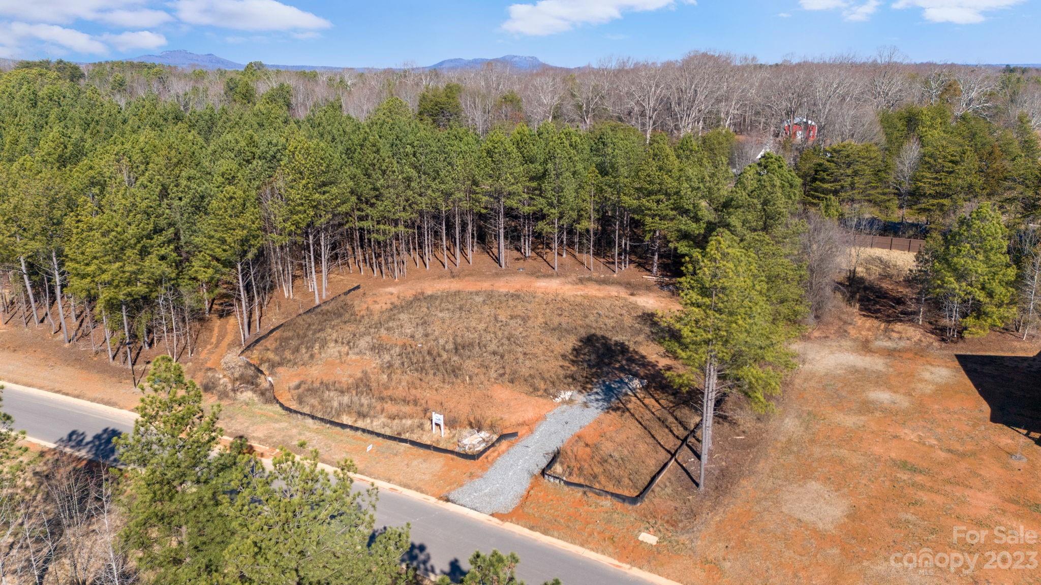 1098 Sage Pine Circle is the blank slate to place your masterpiece of a dream home! With close proximity to many of Clover, SC's wonderful amenities, this lot is in a marvelous location just beginning to grow into a beautiful, and much-desired locale! Please inquire about provided documents/certifications as there are some available. Don't miss out on owning your own piece of lovely Clover, SC Real Estate! NOTE: Trees have been cleared, lot semi-graded, silt fence installed, and construction driveway installed. APPROXIMATE UPGRADE COST: $30,000 already spent readying you to start building.
