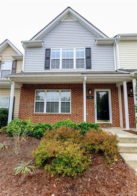 ***MOVE IN READY***You will love this flawless townhome! Owner has replaced all flooring (new hardwood laminate flooring on main and new carpet upstairs/stairway). Gas log fireplace in great room. Two bedrooms and two bathrooms upstairs. Private tree buffer in backyard.