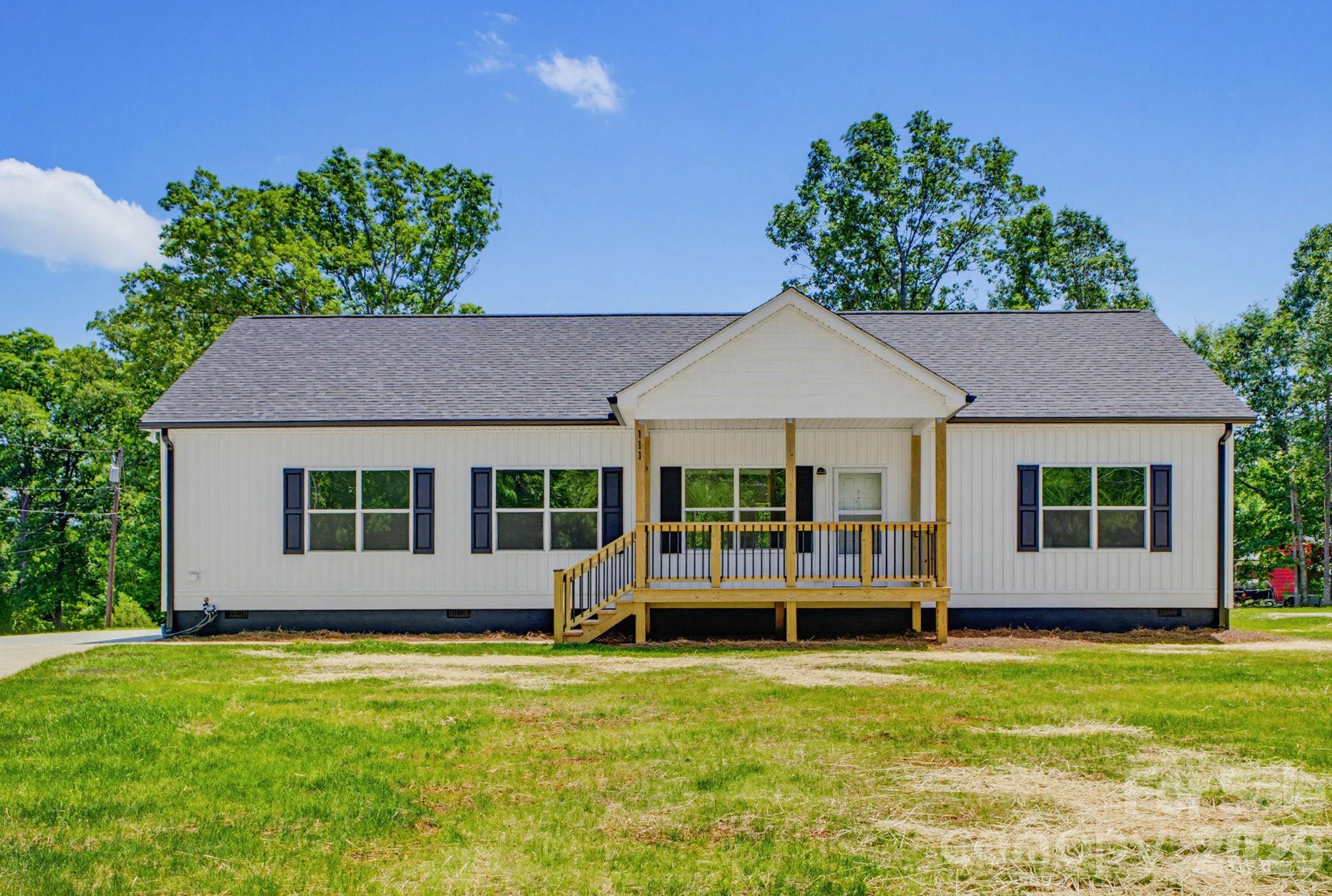 Seller is offering up to 4% of the purchase price toward the buyer's closing costs. New construction home featuring 3 bedrooms, 2 bathrooms, and approximately 1,800 sq. ft. of modern living space on a nearly half-acre lot with no HOA. Built in 2026, this home offers 9-foot ceilings, soft-close cabinetry, stainless steel appliances, a mud room with laundry hookups, large walk-in closets, a walk-in shower, and 720 sq. ft. of attic storage. Enjoy covered front and back porches, a spacious yard, and a concrete driveway with side-by-side parking for two vehicles. A perfect blend of modern style, storage, and small-town comfort.