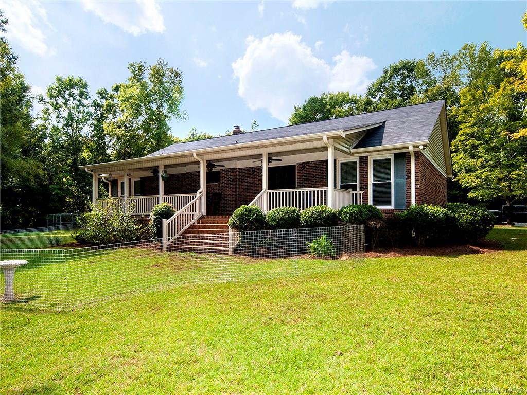 This amazing home is filled with country charm! The huge front porch runs the entire width of the house. You will step from the porch into a lovely foyer, then into the spacious family room. You’ll love the wood stove! The white, bright kitchen is spacious with tons of storage! This home is the perfect ranch floor plan with the master bedroom with its own en suite bath on one side & the other 2 bedrooms with their own bath on the other. There is plenty of room to spread out on your own 7 acres!