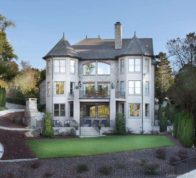 Stunning European inspired waterfront luxury home on a quiet private cove off the main channel of Lake Wylie.
Built by Viking Custom Homes w/exquisite design features! Hardwood flooring throughout all 3 levels, incredible moldings, imported tile & marble, beams & impressive iron work. Stunning gourmet kitchen w/large prep & gathering isle, Viking pro series appliances, custom cabinets & exotic granite. Covered patio overlooking outdoor fireplace and the floating dock & boat slip.One of a kind!