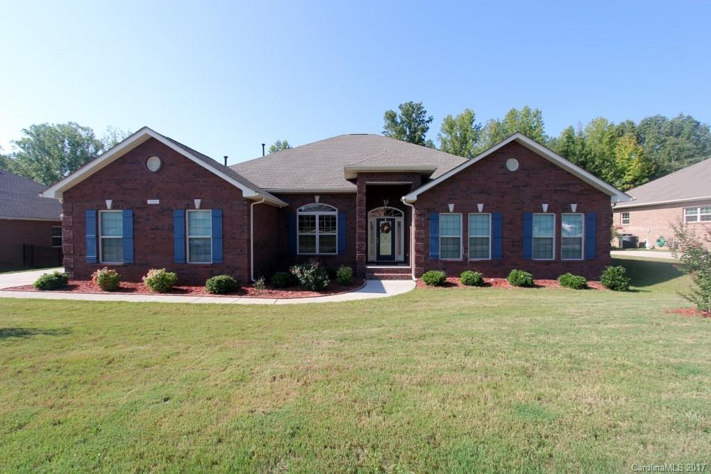 WOW! Make your plans to visit this beautiful full brick ranch home. Features include open floor plan, wood flooring, granite counters, large walk in pantry and so much more. The master retreat offers a huge bedroom space, elegant bath with tile and granite and a huge walk in closet.  For outdoor living there is an oversized screened in patio as well as an extended deck!  Keep your cars out of the elements in the three car side load garage. Schedule your showings today.