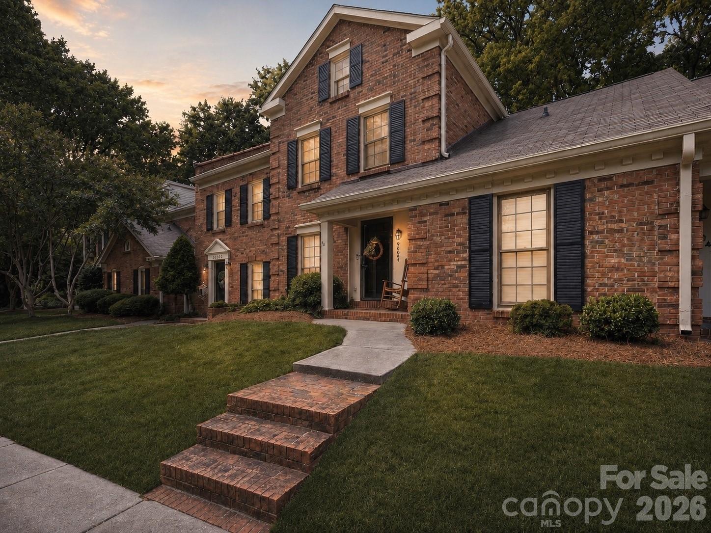 Opportunities like this are hard to come by! Welcome to this beautifully updated, two-story brick townhome in the Sardis Forest Patio Homes community, located less than five minutes from charming Downtown Matthews. This home has been thoughtfully updated with fresh paint, LVP flooring, carpet (2024), elevated kitchen and bath finishes, upgraded light fixtures, and modern touches throughout.  The remodeled kitchen highlights butcher block countertops, white cabinetry, updated hardware, an oversized undermount sink, breakfast bar seating, and plenty of space for everyday living and entertaining. The spacious family room is centered around a cozy wood-burning fireplace, while double doors open to a private, fenced courtyard surrounded by mature trees. A convenient outdoor storage closet provides additional space for patio furniture, tools, and seasonal items. The main-level half bath has been completely refreshed with moody, color-drenched paint, a painted vanity, open shelving, and updated lighting and mirror selections. Upstairs, two generously sized bedrooms share an upgraded full bathroom featuring luxury vinyl tile flooring and tub with tile surround (2024). Enjoy added peace of mind with a new water heater (2026) and a newer HVAC system (2021). Two assigned parking spaces are also included. Enjoy the option of purchasing a membership at the nearby Sardis Forest Swim Club, featuring a 25-meter pool, swim team, family activities, and community events throughout the summer! Conveniently located less than five minutes from Downtown Matthews, with an abundance of shopping, dining, and entertainment options! Easy access to I-485 and Highway 74 places SouthPark and Uptown Charlotte just 20 minutes away. This is a wonderful opportunity to enjoy an updated townhome in a quiet, wooded community without sacrificing the convenience of everything South Charlotte has to offer!