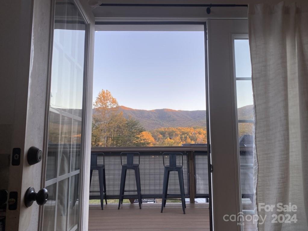 Beautiful mountain views, close to downtown Black Mountain. Unfinished basement and plumbing already installed in slab. Easily finish the lower level for larger family room, full bathroom, and extra bedroom. The corner of basement is plumbed for wet bar or mini kitchen. You could keep the bottom half separate to create an income renting. OR create your own art studio/workshop. Superior walls built the lower level, the top level was constructed as one whole house stick built modular with 6-inch studs, making for one solid structure. Each room has its own mini split. The second bedroom has a large loft 8X12. The yard is partially fenced. There is parking for 3 vehicles behind the house and 1 on the side. Appliances stay including washer/dryer, stove/oven, refrigerator, 6 bar stool chairs may also stay, they are perfect for the bar top around the edge of the deck. You get great sun with full southern exposure and could easily make a great garden.