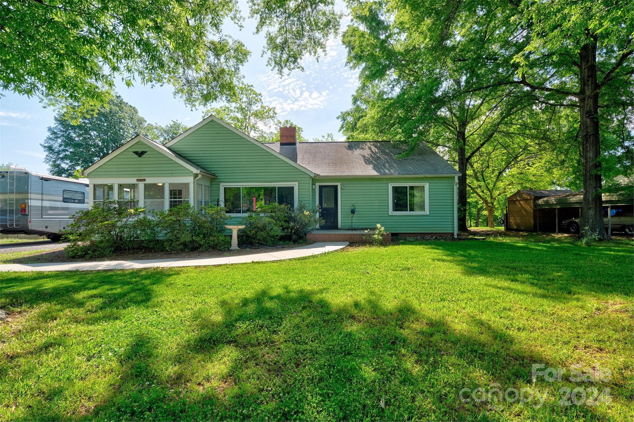 Amazing remodel on this older home and done with love!Location is the key for this 1. This wonderful home is in the heart of Fort Mill and walkable to downtown with restaurants,breweries,shopping and the awesome Walter Elisha park with new concert shell.Easy access to I77 or Hwy 21 to commute to Charlotte, Ballantyne or Rock hill and beyond.Sellers have redone every room. The kitchen is bright and cheery with quartz counters and stainless appliances and wine fridge.The great room offers big bay window to capture the sun and bring the outside in!  Primary bedroom has built ins and its own entry door. Secondary bedroom has an ensuite full bath and other bedroom has dual closets.Cozy front porch with tons of windows and entry door.The backyard is phenomenal and endless possibilities.Build a treehouse with the huge trees or detached garage.All new HVAC and encapsulated crawl space.You are welcomed when you walk through the door. Quiet tree lined side street and close to excellent schools!
