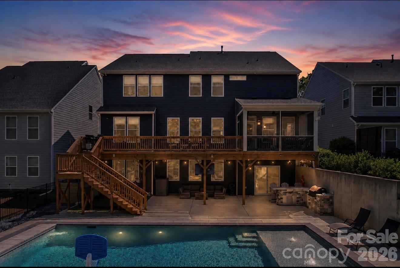 The one you have been waiting for! Stunning 2-story home with a fully finished walk-out basement featuring 6 bedrooms and 5 full bathrooms, perfectly positioned at the end of a cul-de-sac with no neighbors in front or behind for ultimate privacy. Enjoy direct access to the neighborhood trailhead entrance creating a peaceful setting. The gourmet chef’s kitchen features quartz countertops, a designer tile backsplash, butler’s pantry, under-cabinet lighting, stainless steel appliances, gas cook-top, and upgraded lighting. 
The spacious primary suite offers a true retreat with dual walk-in closets and a luxurious ensuite bath featuring separate his-and-her vanities, a large garden tub, and an oversized walk-in shower.
Guest suite on main level with full bath. 
Built for entertaining, the backyard showcases an incredible heated saltwater pool installed in September 2025 featuring a CoverMatic automatic pool cover with lock and key, over 30 feet in length, and an oversized 7’ x 15’ tanning ledge. The outdoor entertaining area includes a bar area, refrigerator, gas grill space and custom under-deck ceiling with built-in draining, allowing you to enjoy the outdoor rain or shine. This rare combination of luxury, privacy, and outdoor living is hard to find. Additional upgrades include a tankless water heater and separate HVAC units for each level — basement, main floor, and second floor — providing enhanced comfort and efficiency throughout the home. 
Prime Fort Mill location is just minutes from I-77, Charlotte, Ballantyne, and Uptown. Situated in a top-rated school district and close to shopping, dining, and parks. This amenity-rich community features a clubhouse, fitness center, playground, two outdoor pools, walking trails, paddle sport launch, Catawba River access, and so much more!