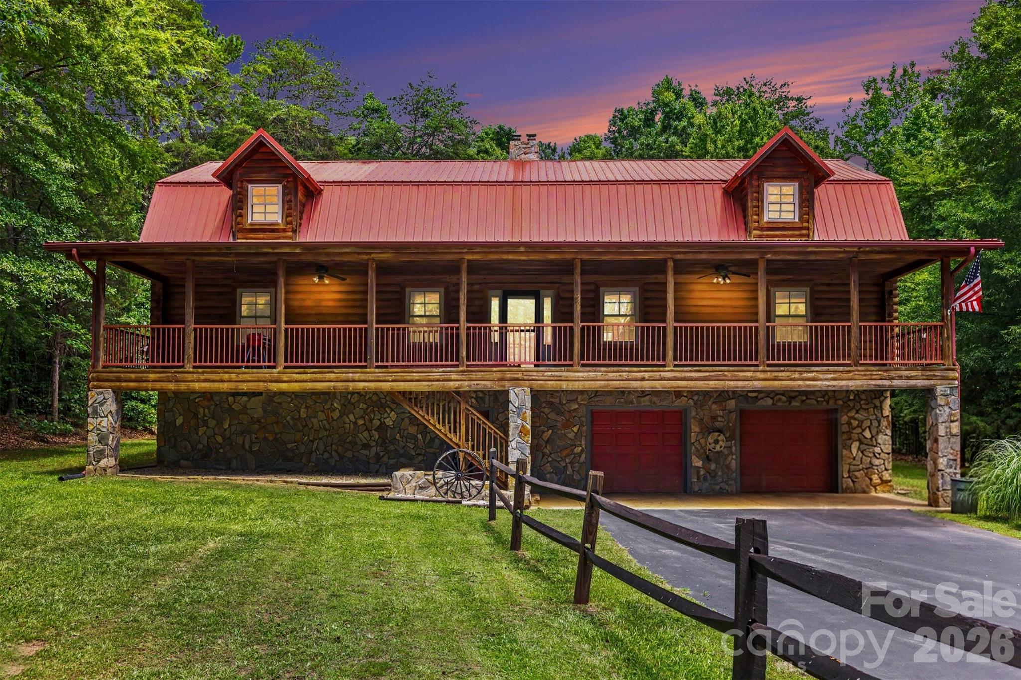 Discover a truly one-of-a-kind retreat at 6328 Four Knights Lane in Clover, SC. Custom-built with authentic cypress logs and exceptional craftsmanship throughout, this remarkable home showcases a level of quality, character, and durability that is increasingly rare to find. From the exposed beams and solid wood finishes to the thoughtfully designed three-level floor plan, every detail reflects pride of ownership and timeless construction.

Nestled on private acreage at the end of a long paved drive, this property offers the perfect balance of seclusion and convenience. Enjoy the peace and privacy of country living while remaining just minutes from Lake Wylie and an easy commute to Charlotte, giving you quick access to premier dining, shopping, entertainment, and employment opportunities while still coming home to your own private retreat.

Inside, soaring ceilings, warm wood tones, and true lodge-style architecture create an atmosphere that feels both grand and inviting. With over 3,500 square feet of living space, the home offers flexibility for entertaining, multi-generational living, hobbies, or simply spreading out and enjoying the surroundings.

Car enthusiasts, hobbyists, and those needing extra storage will appreciate the incredible garage space. In addition to the attached four-car garage, the property also features a separate detached two-car garage, providing room for up to six vehicles, recreational equipment, workshop space, or additional storage.

Whether you're searching for a private homestead, a weekend escape, or a distinctive primary residence near Lake Wylie and Charlotte, 6328 Four Knights Lane delivers unmatched craftsmanship, exceptional garage capacity, and a lifestyle that's increasingly difficult to find.