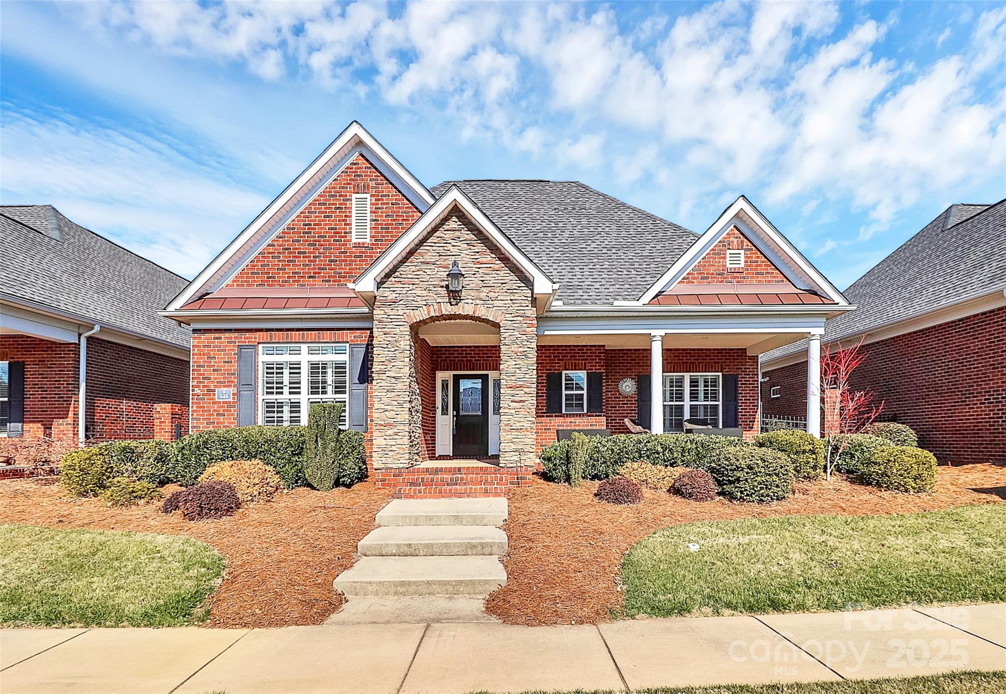 Beautiful full brick home in Augusta place at Laurel Creek, a vibrant 55+ community featuring an open floor plan with designer touches like wide crown molding, baseboards, and a tray ceiling in the dining area. Plantation shutters dress the windows throughout the home. A gas fireplace, and built-in bookshelves add charm to the living room. The kitchen boasts granite countertops, a tile backsplash, a double-sided sink, ample cabinets, a walk-in pantry, and a built-in desk area.  The spacious primary bedroom ensuite offers his-and-her closets, a large tiled shower, and quartz countertops in both bathrooms. Third bedroom does not have a closet and is currently being used as an office. Outdoor living is a delight with a front porch, glass-enclosed porch, and a paver patio with two gates. Enjoy resort-style amenities, including pickleball courts, an outdoor pool, a clubhouse, a fitness center, and more.