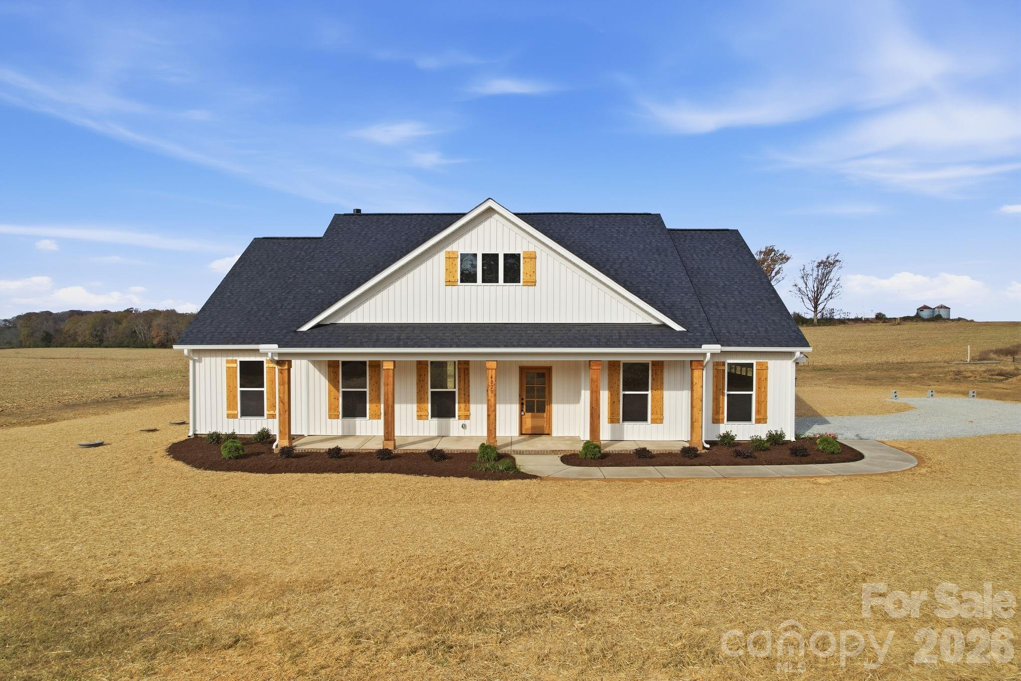 Welcome to this inviting country farmhouse, complete with wide covered front and back porches made for sipping  tea and enjoying peaceful country sunsets. Inside, an open-concept design and vaulted living room create a warm, airy gathering space that feels like home the moment you walk in.

The kitchen blends charm and function with a large island, quartz countertops, soft-close cabinets, and plenty of room for cooking and conversation. The primary suite offers a relaxing retreat with its large, tiled walk-in shower and cozy finishes. A spacious bonus room adds flexibility for a guest space, hobby room, or home office.

All of this sits on a beautiful .95 acre country lot, giving you room to roam, garden, play, or simply enjoy the quiet. A true slice of country living with modern comforts woven throughout.  Up to $3500 in seller credit when you use approved lender.